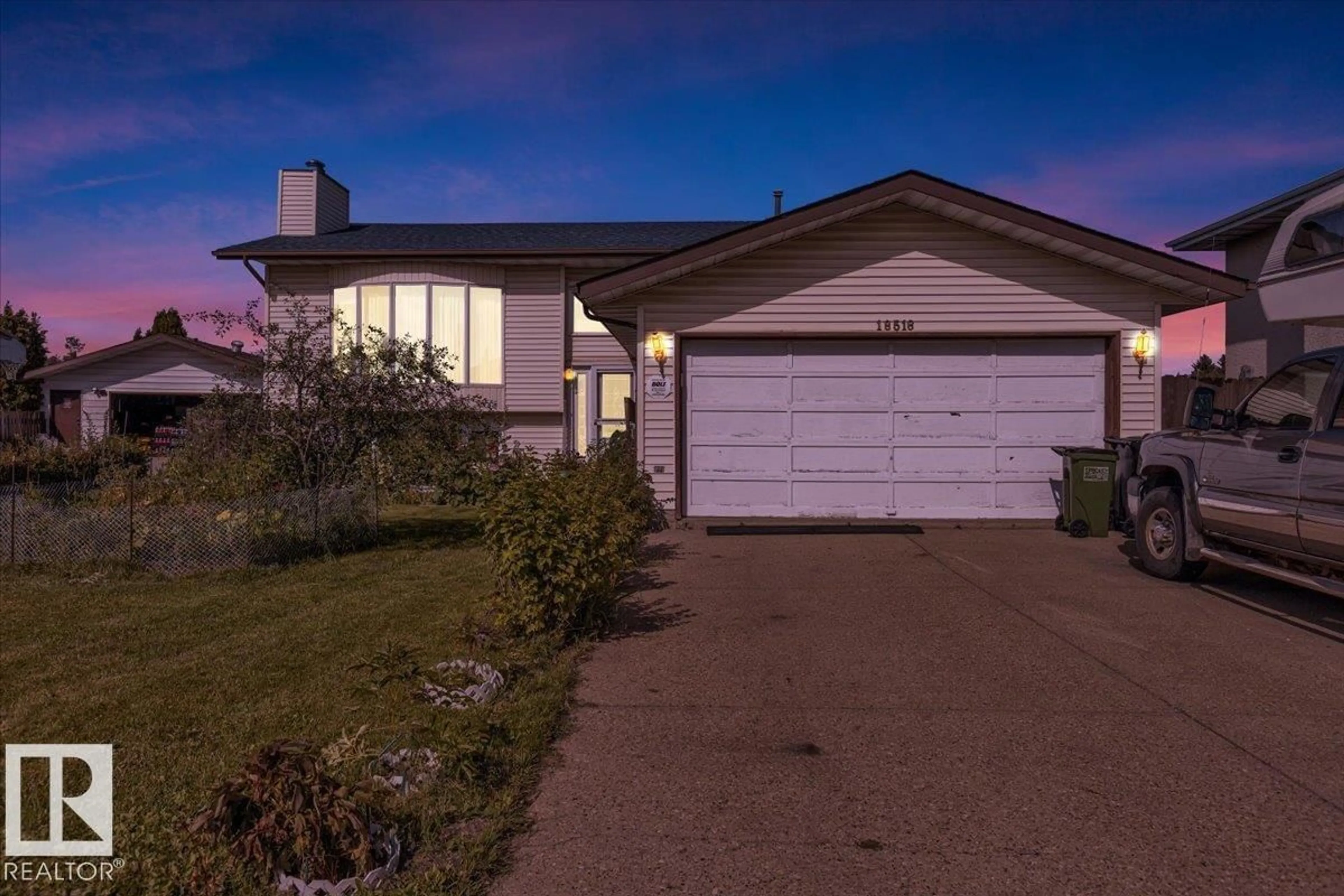 Home with vinyl exterior material, street for 18516 96 AV, Edmonton Alberta T5T4M4