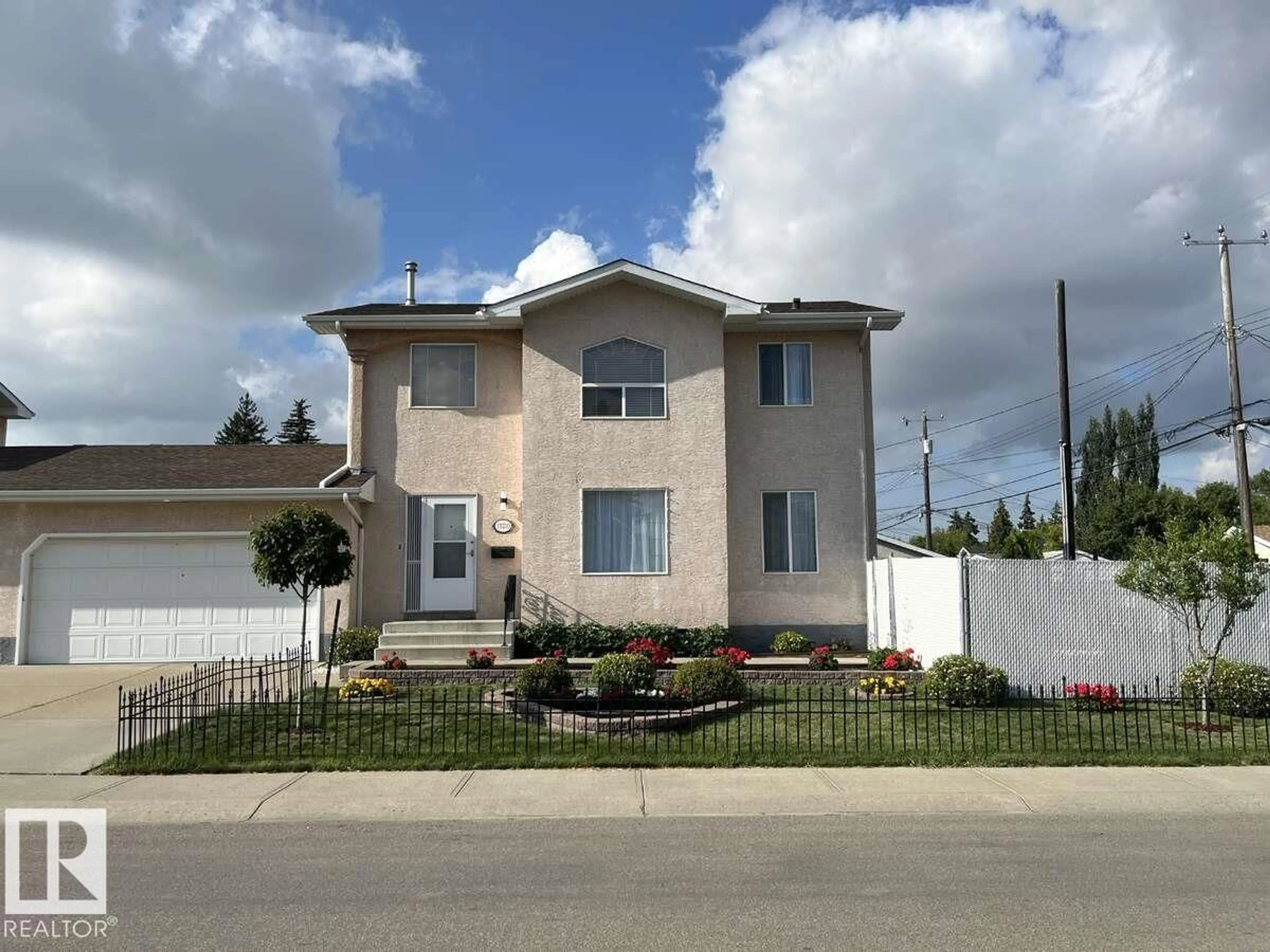 Home with vinyl exterior material, street for 15210 103 AV, Edmonton Alberta T5P4T7