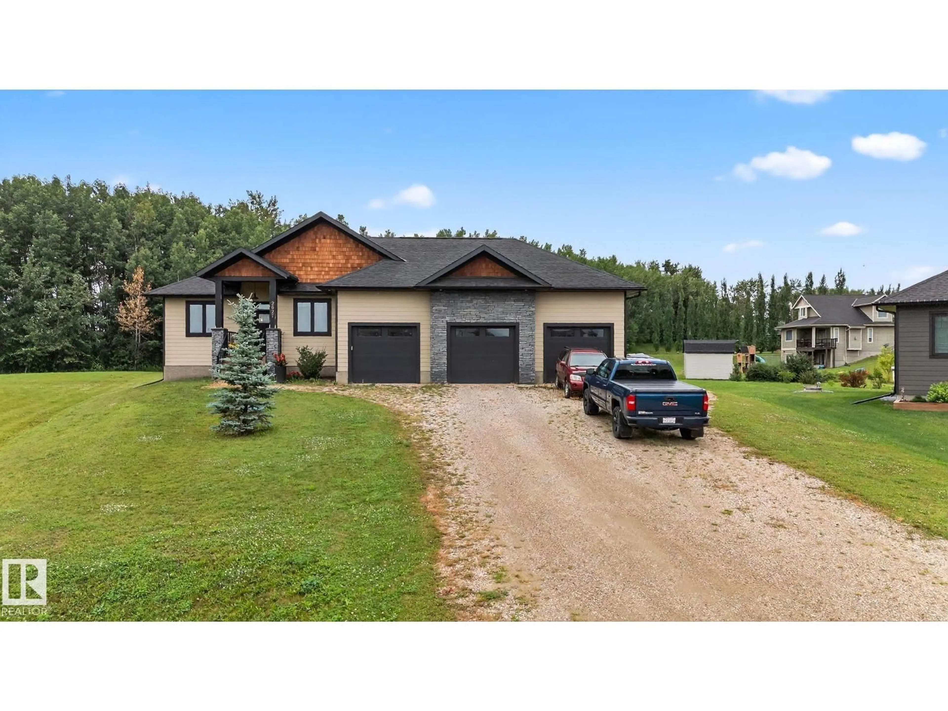A pic from outside/outdoor area/front of a property/back of a property/a pic from drone, street for 2027 JUNIPER LN, Rural Parkland County Alberta T7Z0G8