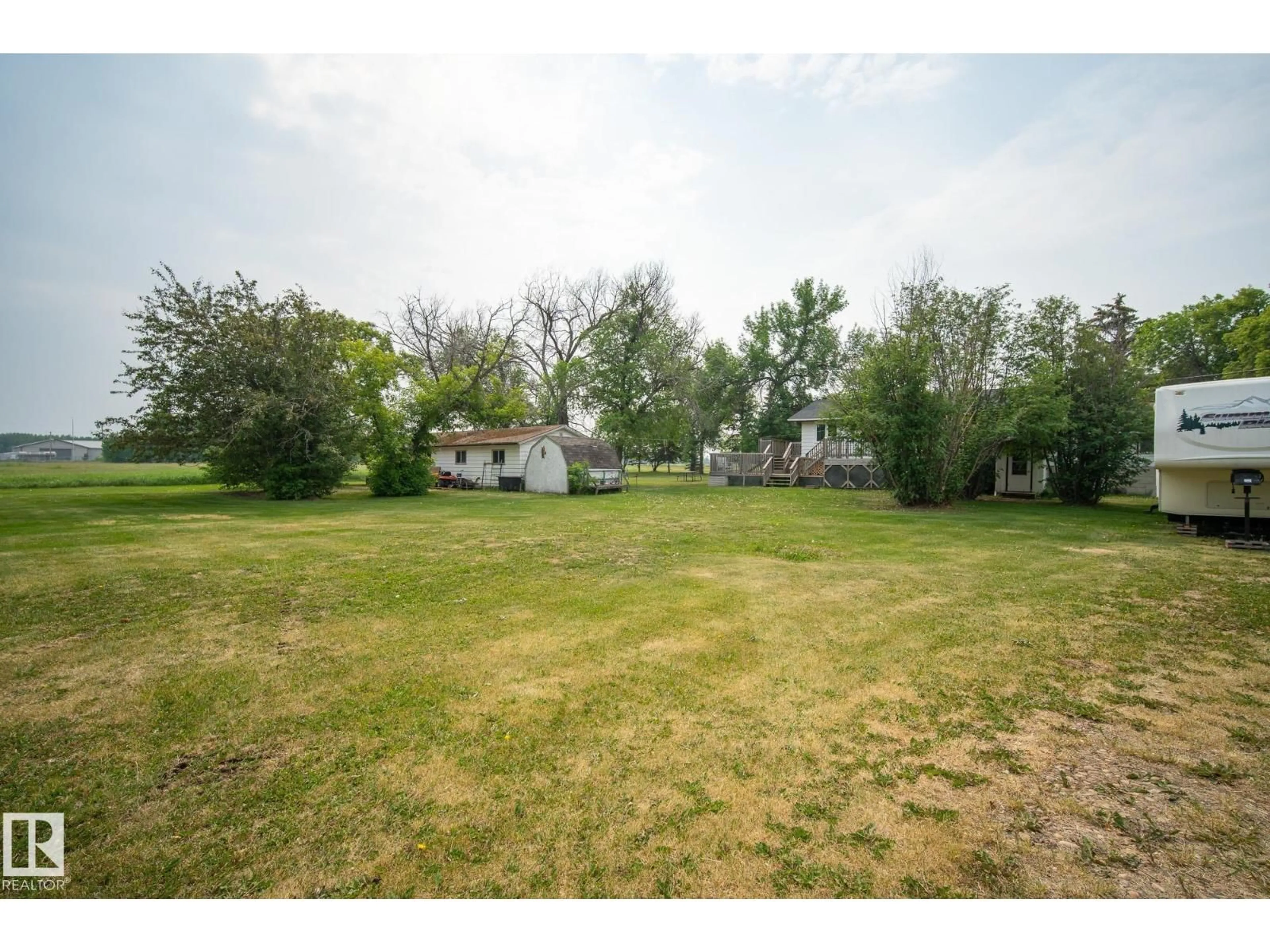A pic from outside/outdoor area/front of a property/back of a property/a pic from drone, unknown for 320 1 AV, Thorhild Alberta T0A3J0