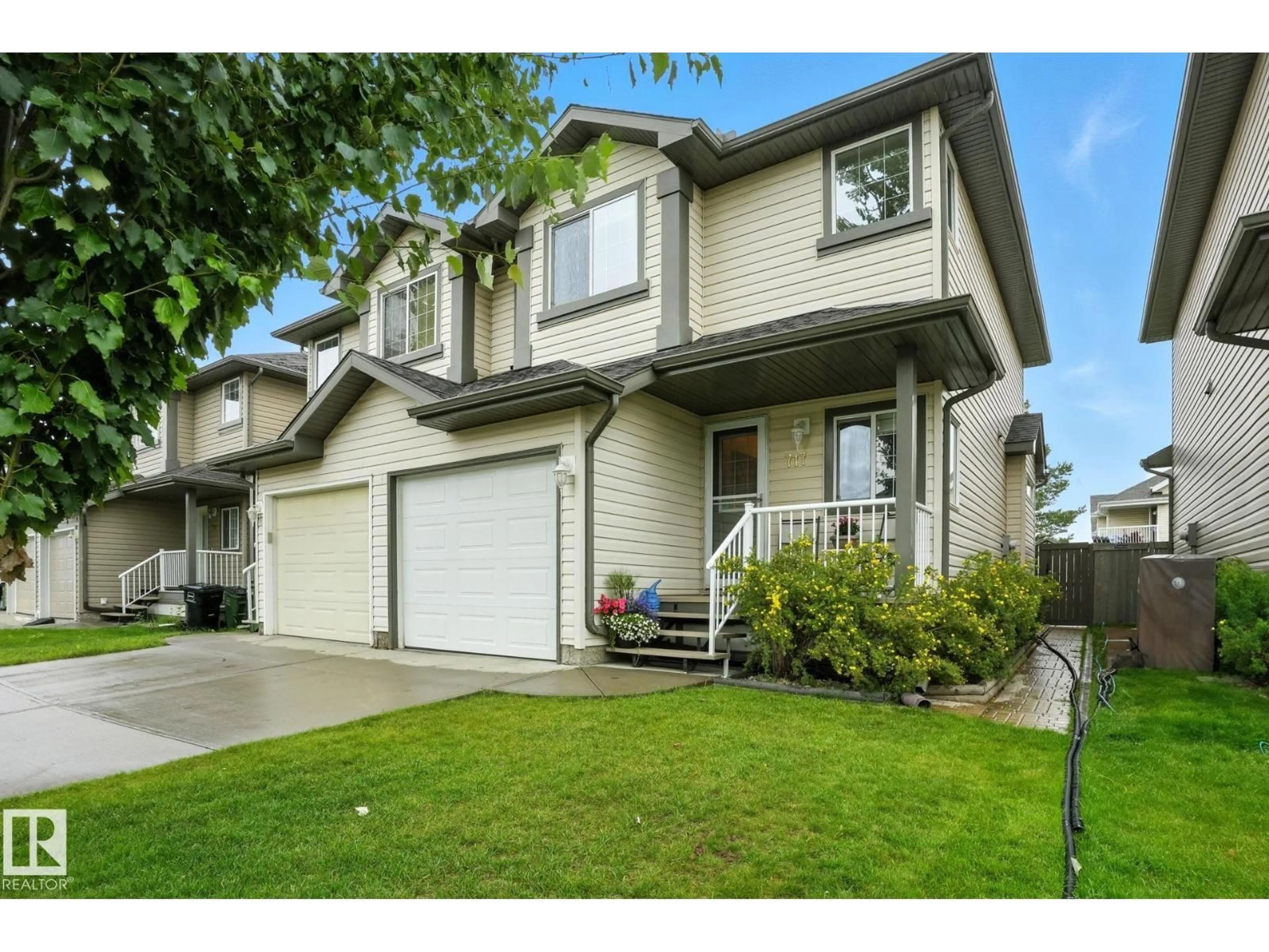 Home with vinyl exterior material, street for 717 82 ST, Edmonton Alberta T6X1L8
