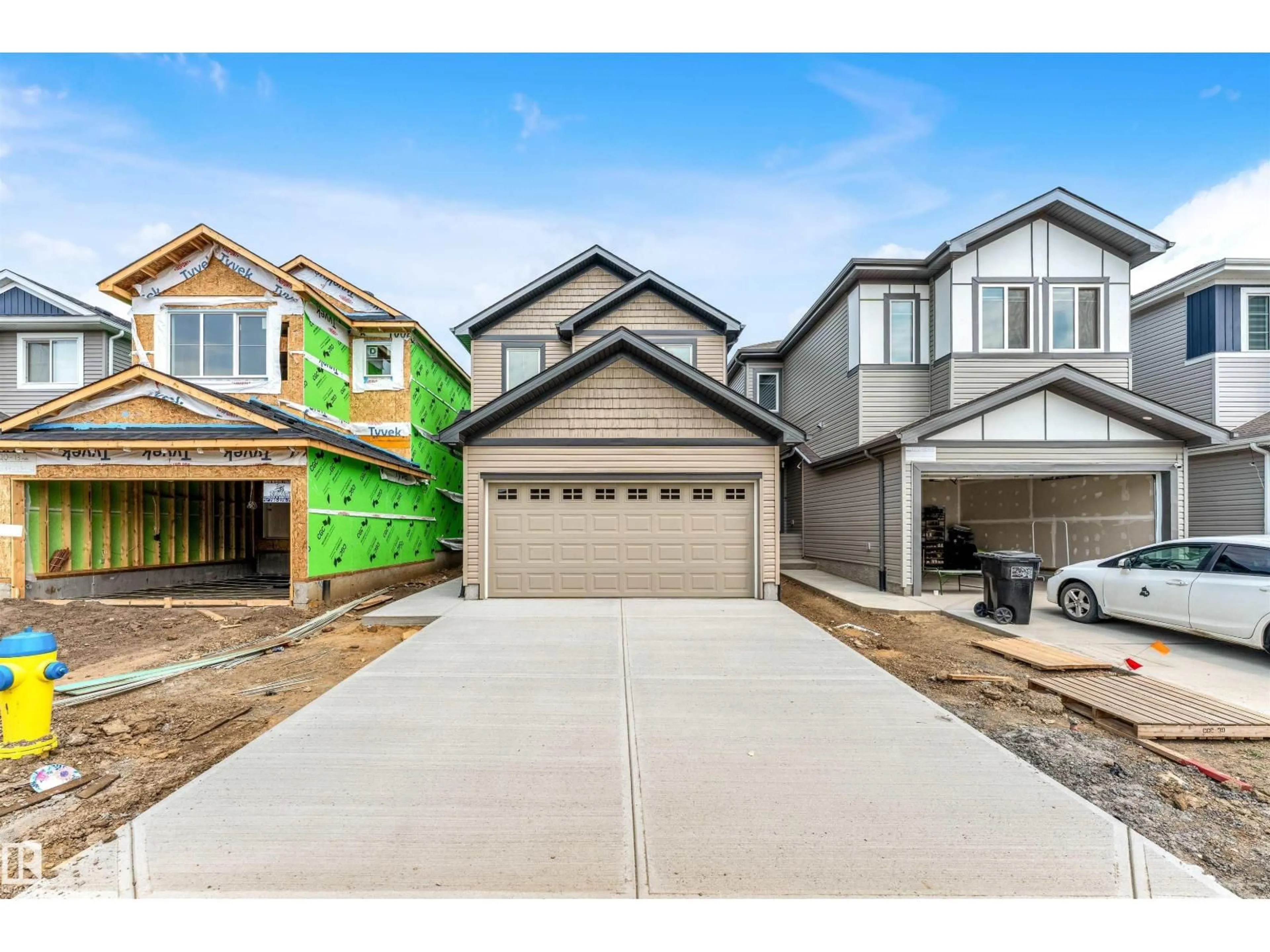 Home with vinyl exterior material, street for 1216 13 AVE NW, Edmonton Alberta T6T2W2