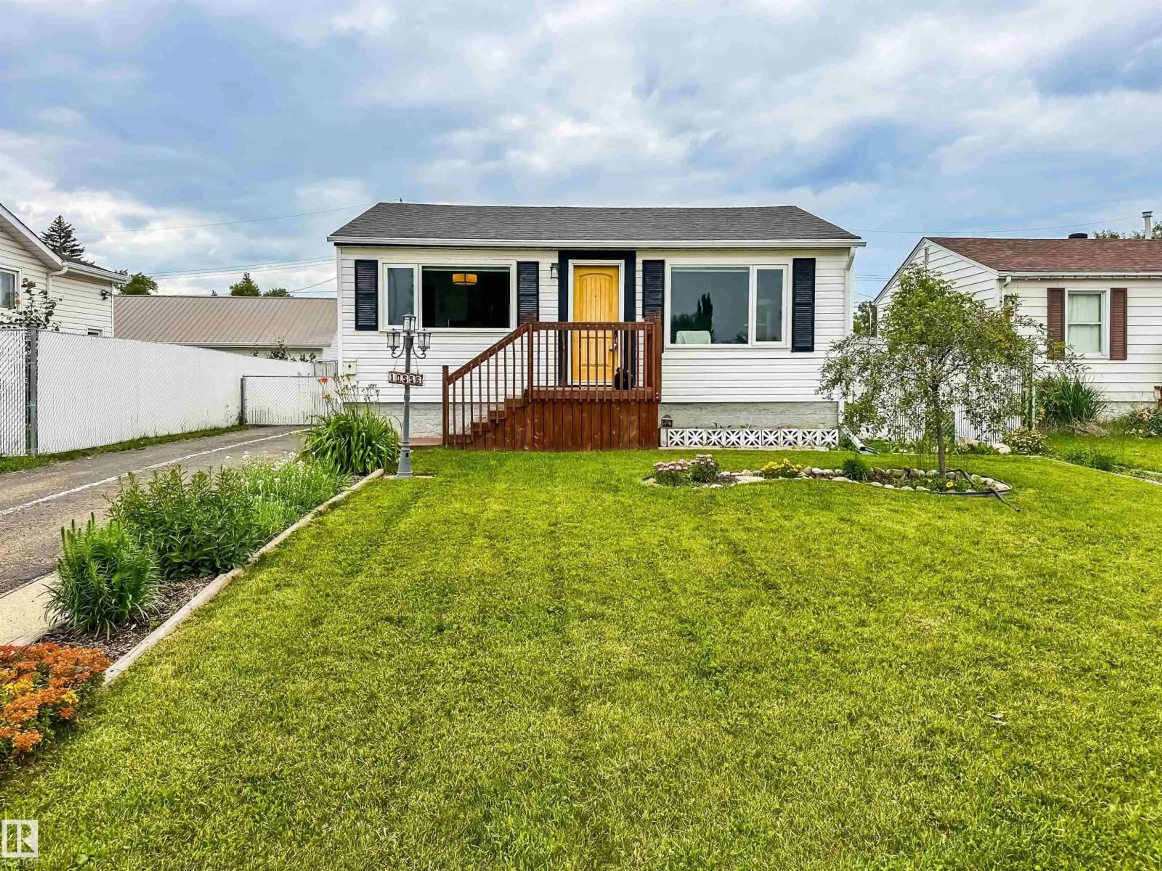 Home with vinyl exterior material, street for NW - 10556 162 ST, Edmonton Alberta T5P3M5