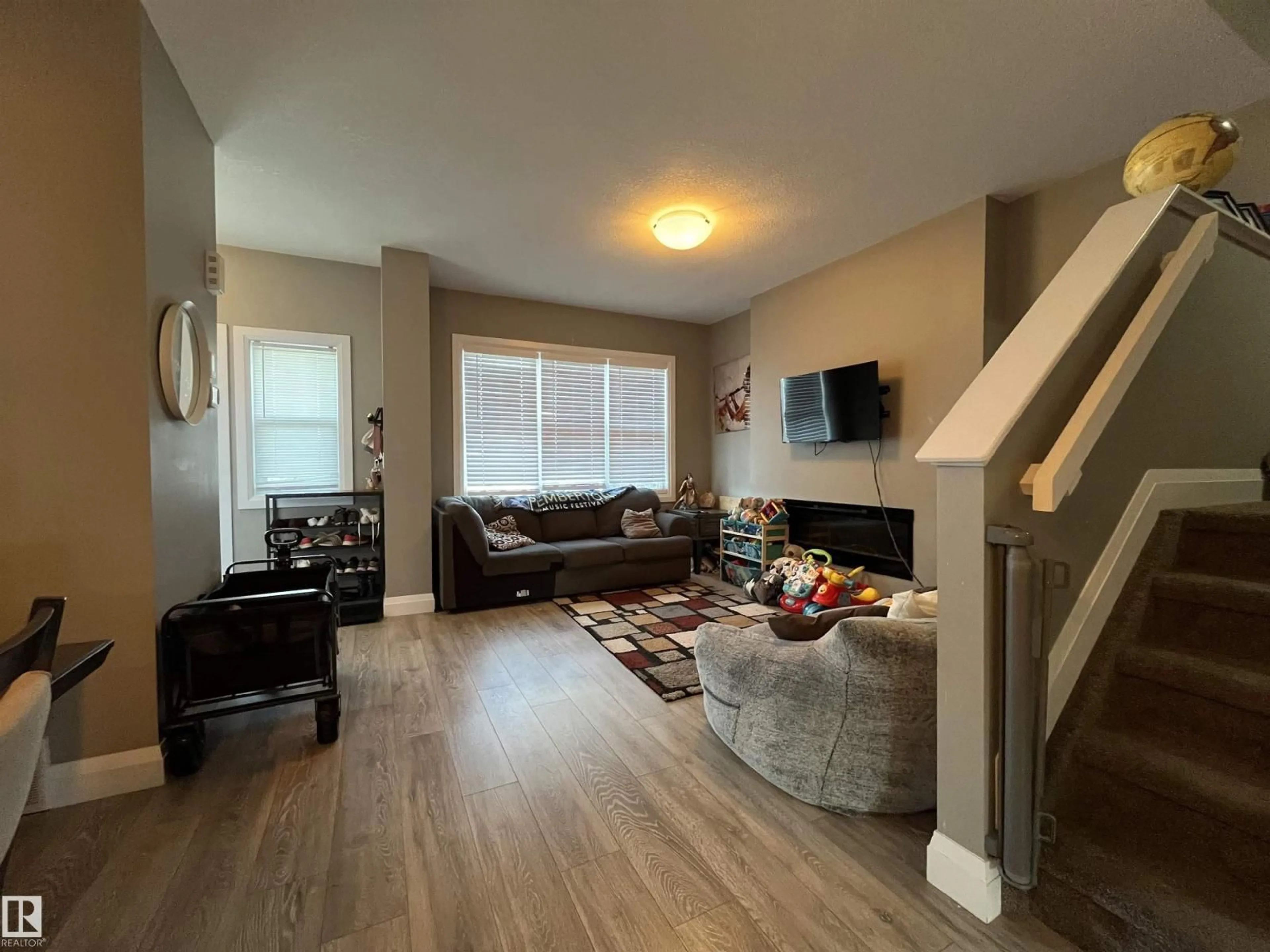 Living room with furniture, wood/laminate floor for 2036 SOUTH CREEK DR, Stony Plain Alberta T7Z0J8
