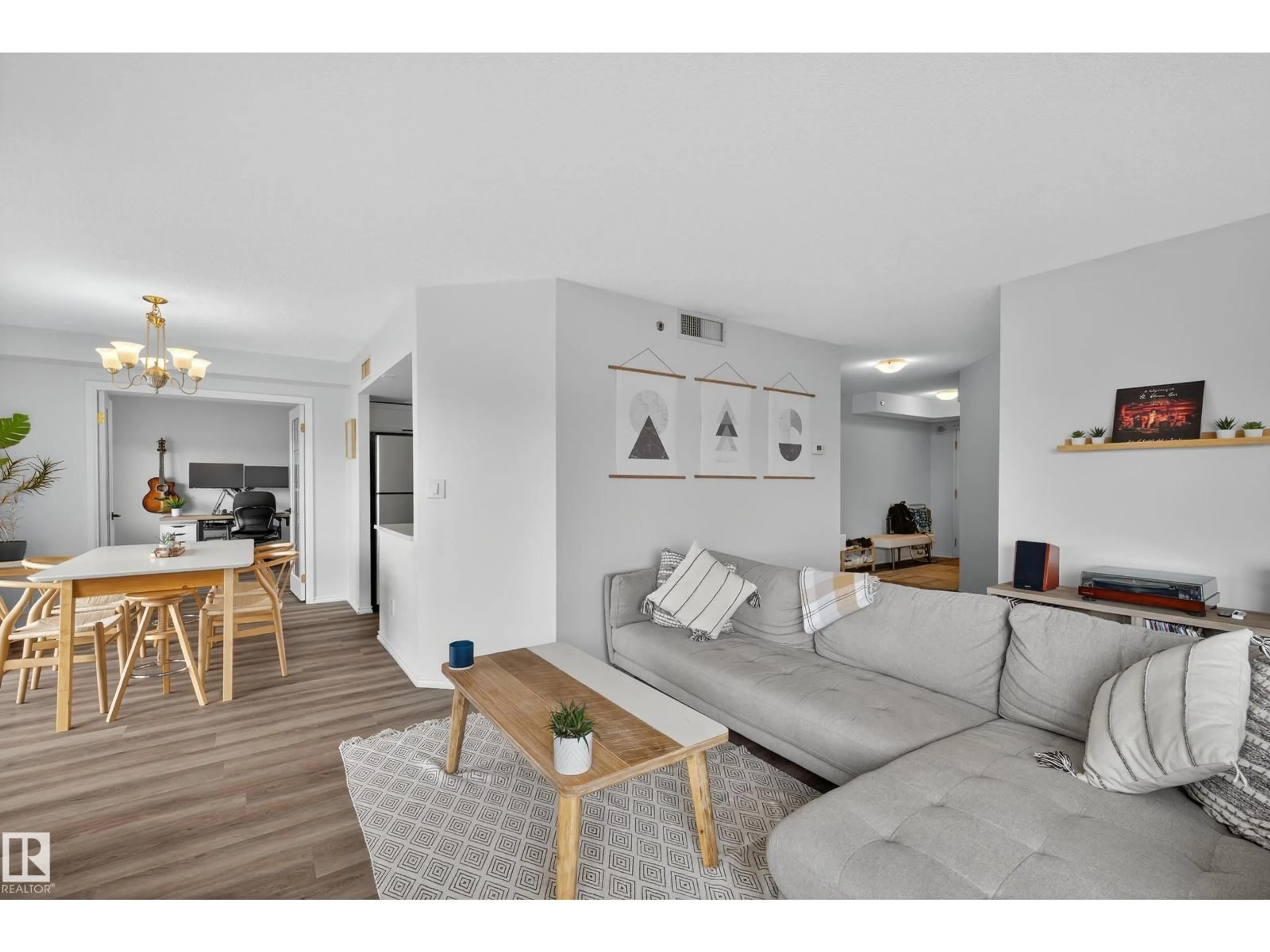 Living room with furniture, wood/laminate floor for 10130 - 1303 114 ST, Edmonton Alberta T5K2S6