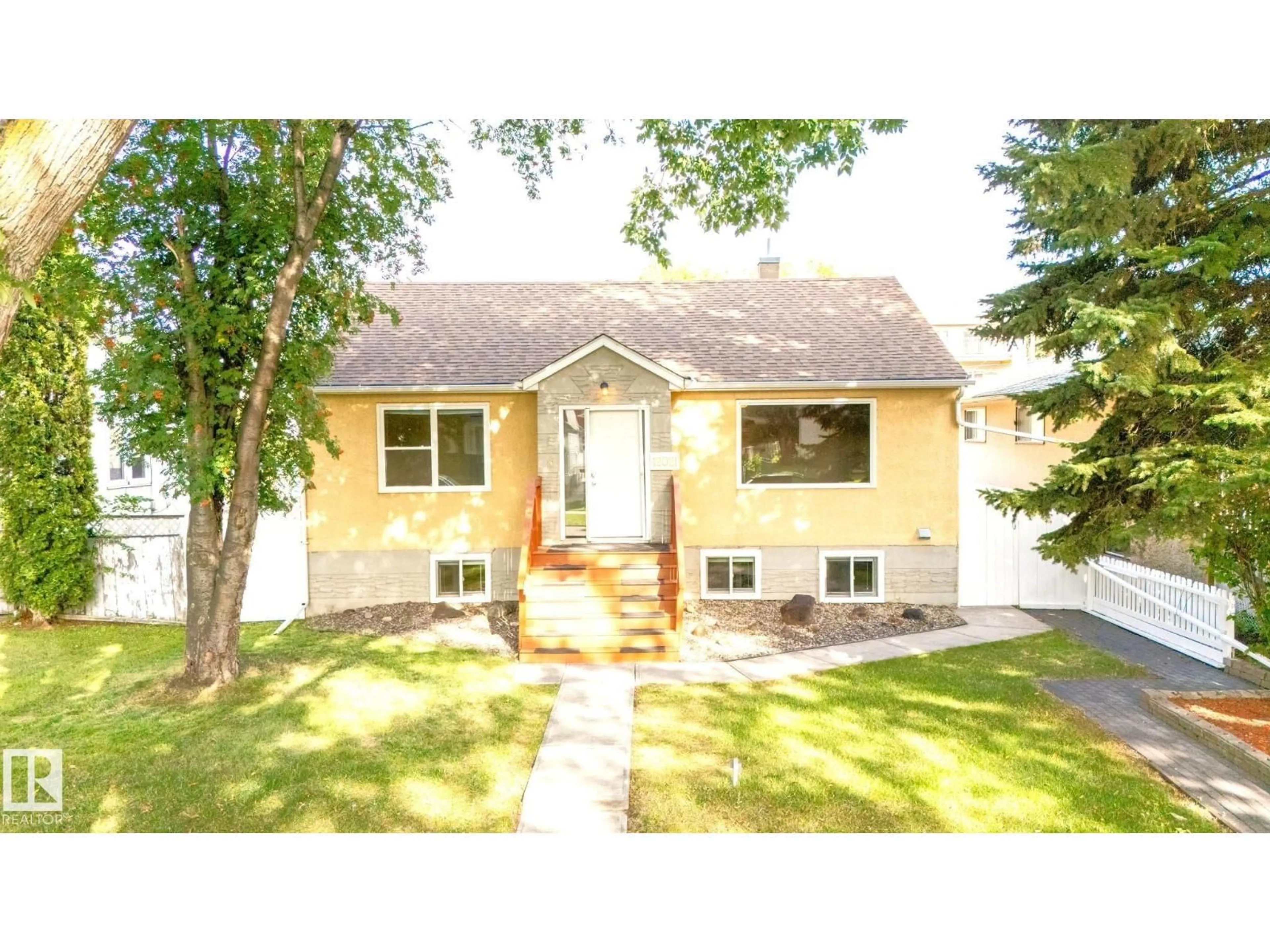 Home with vinyl exterior material, street for NW - 12021 67 ST, Edmonton Alberta T5B1M4