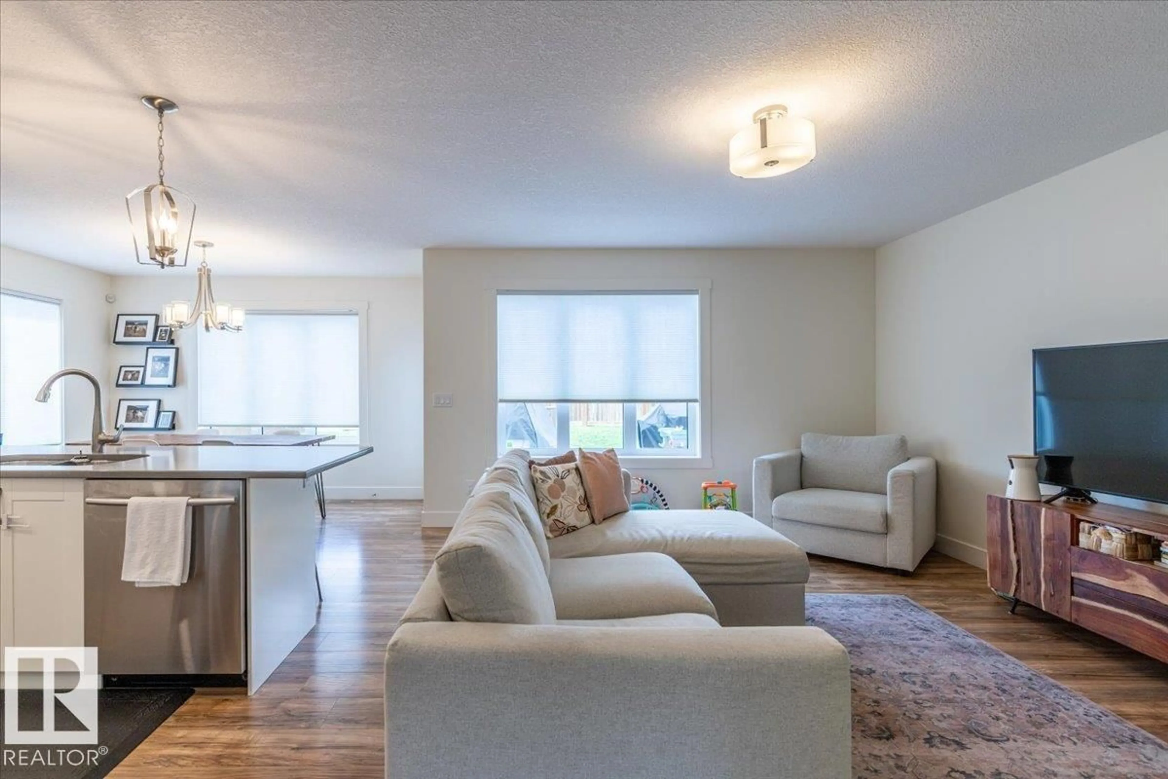 Living room with furniture, wood/laminate floor for 5236 47 AVE, Calmar Alberta T0C0V0