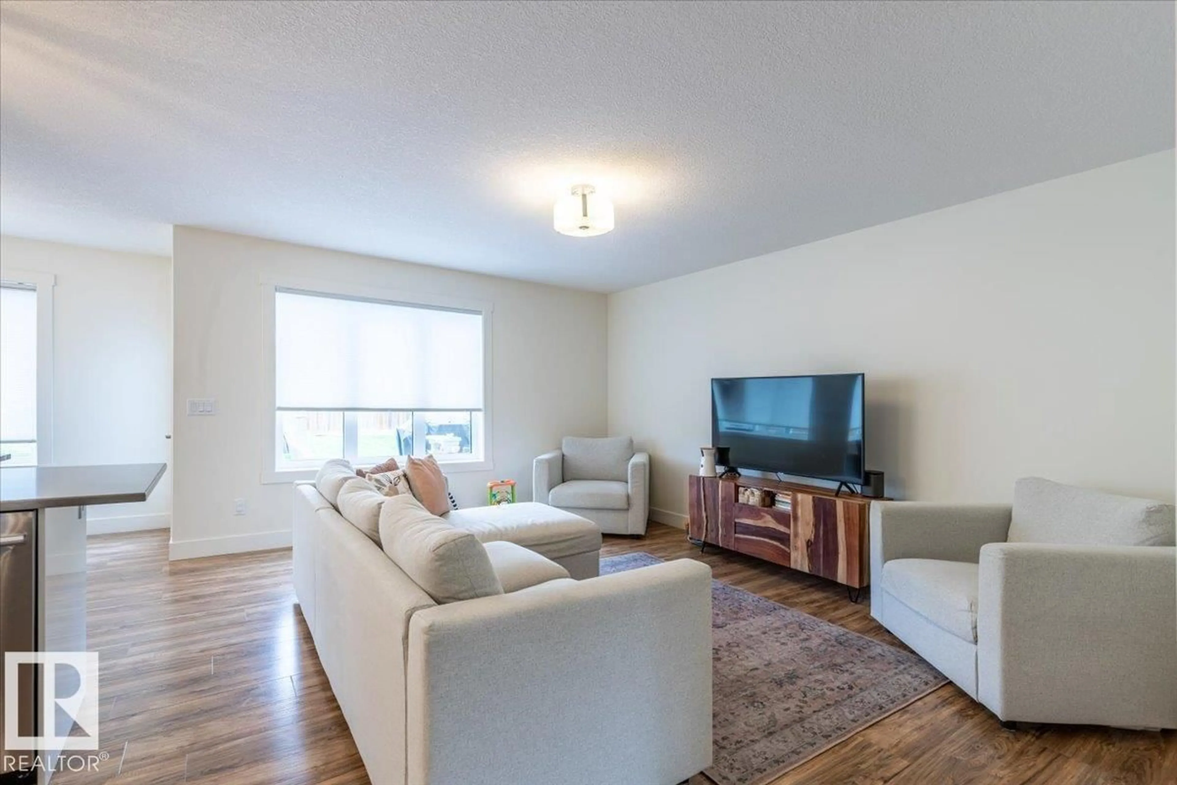 Living room with furniture, wood/laminate floor for 5236 47 AVE, Calmar Alberta T0C0V0