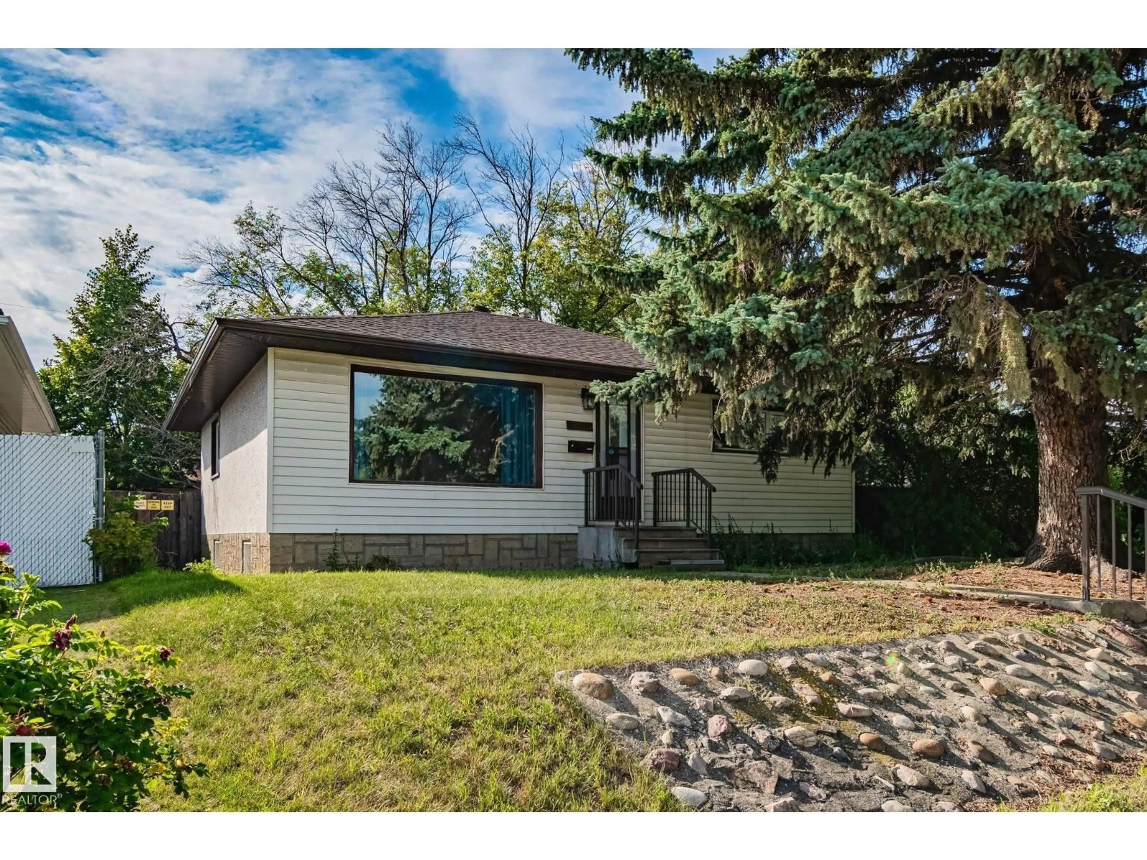Home with vinyl exterior material, street for 13340 123 ST, Edmonton Alberta T5L0J9