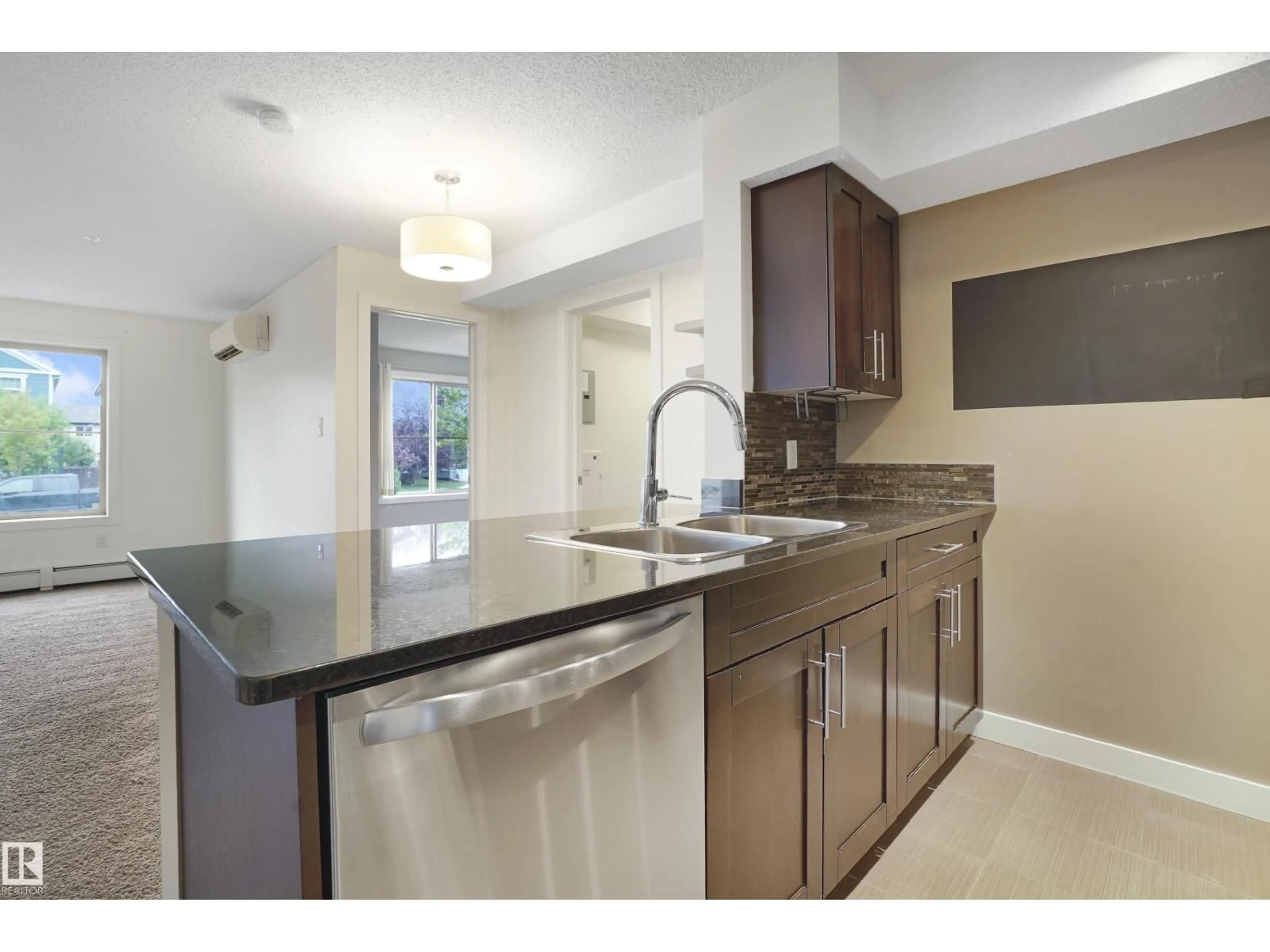 Open concept kitchen, ceramic/tile floor for 108 - 1080 MCCONACHIE BV, Edmonton Alberta T5Y0X2