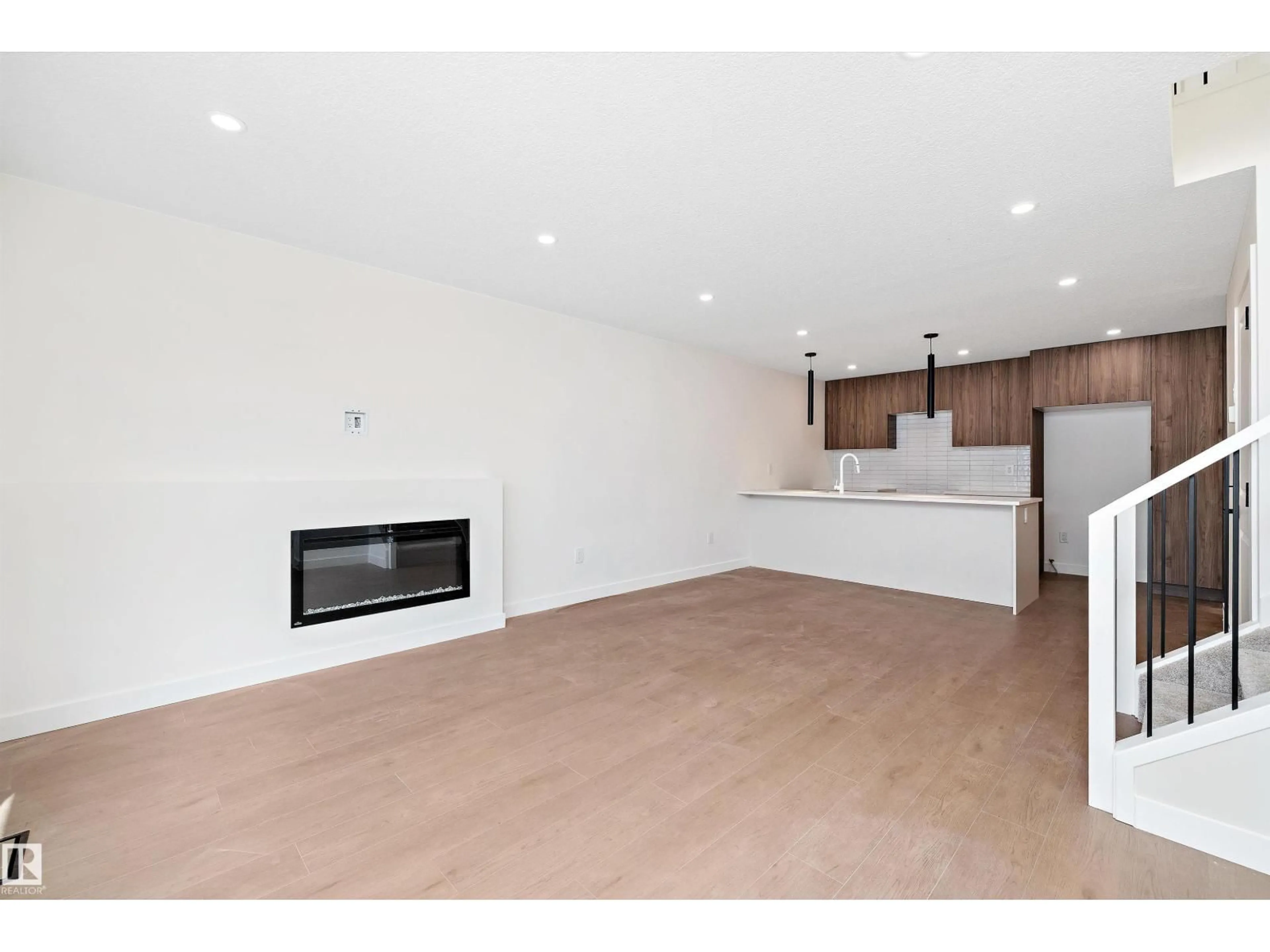 Open concept kitchen, wood/laminate floor for 11738 91 ST, Edmonton Alberta T5B4B3