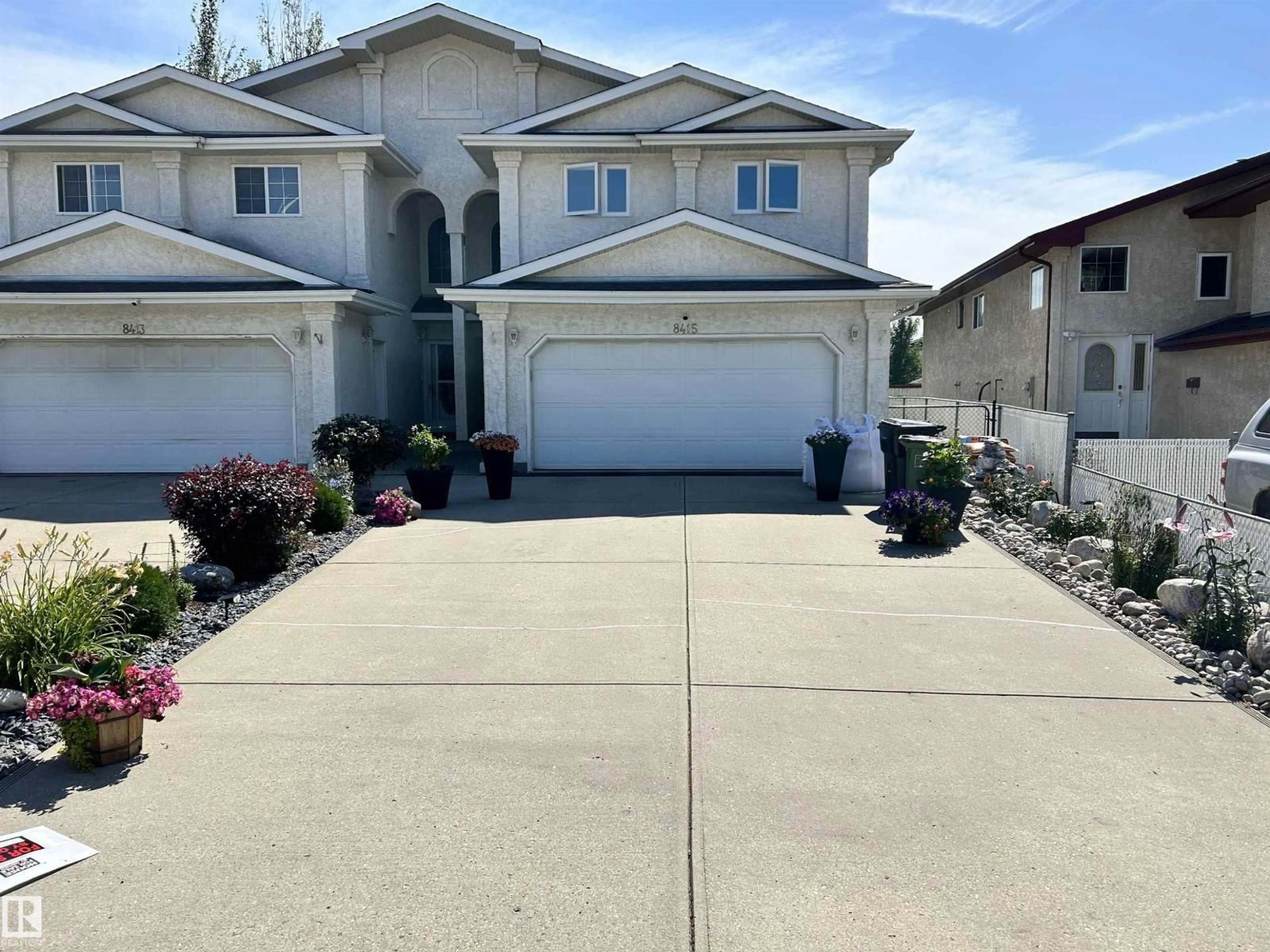 A pic from outside/outdoor area/front of a property/back of a property/a pic from drone, street for 8415 156 AV, Edmonton Alberta T5Z3B4