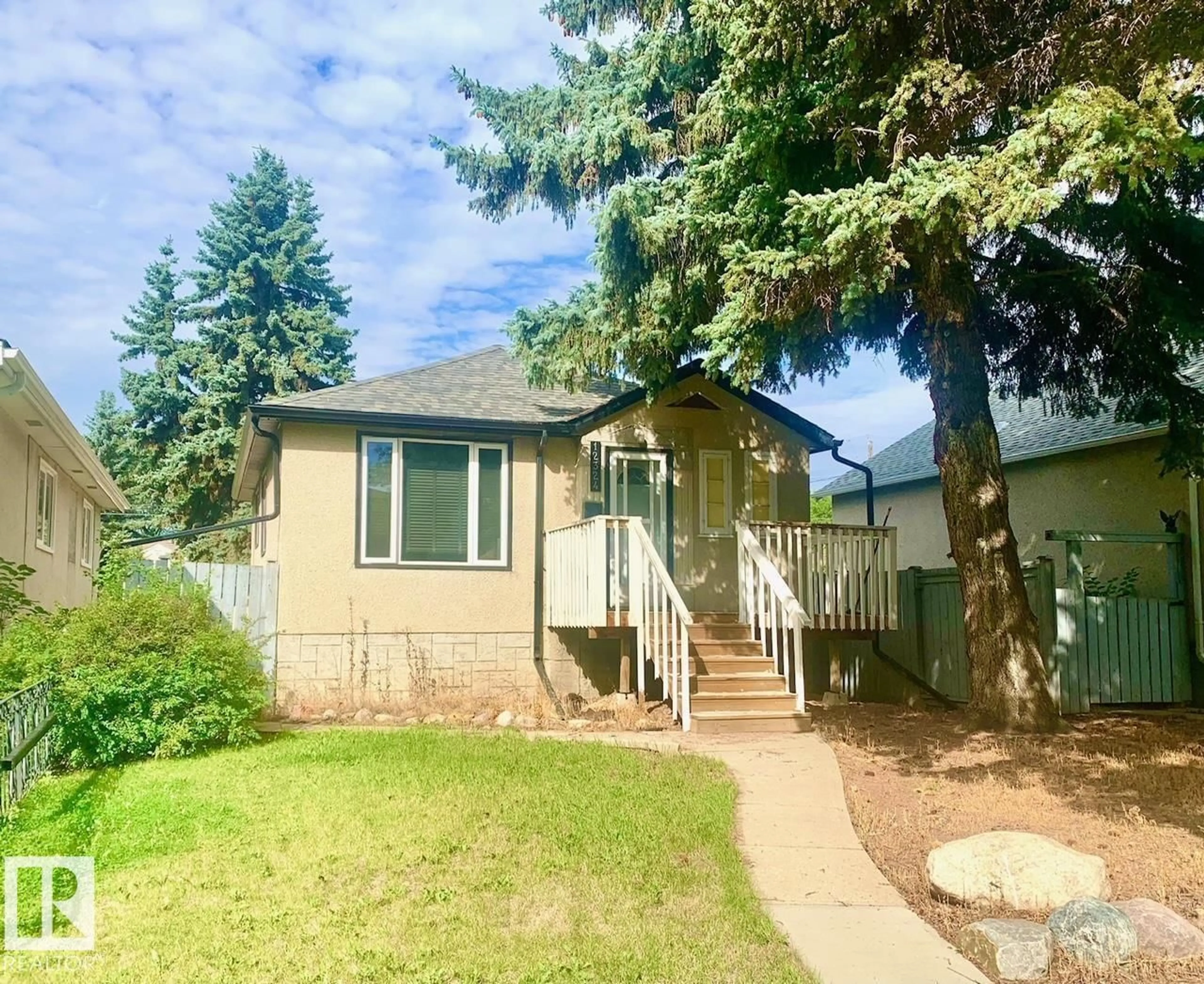 Home with vinyl exterior material, street for 12324 86 ST, Edmonton Alberta T5B3L2