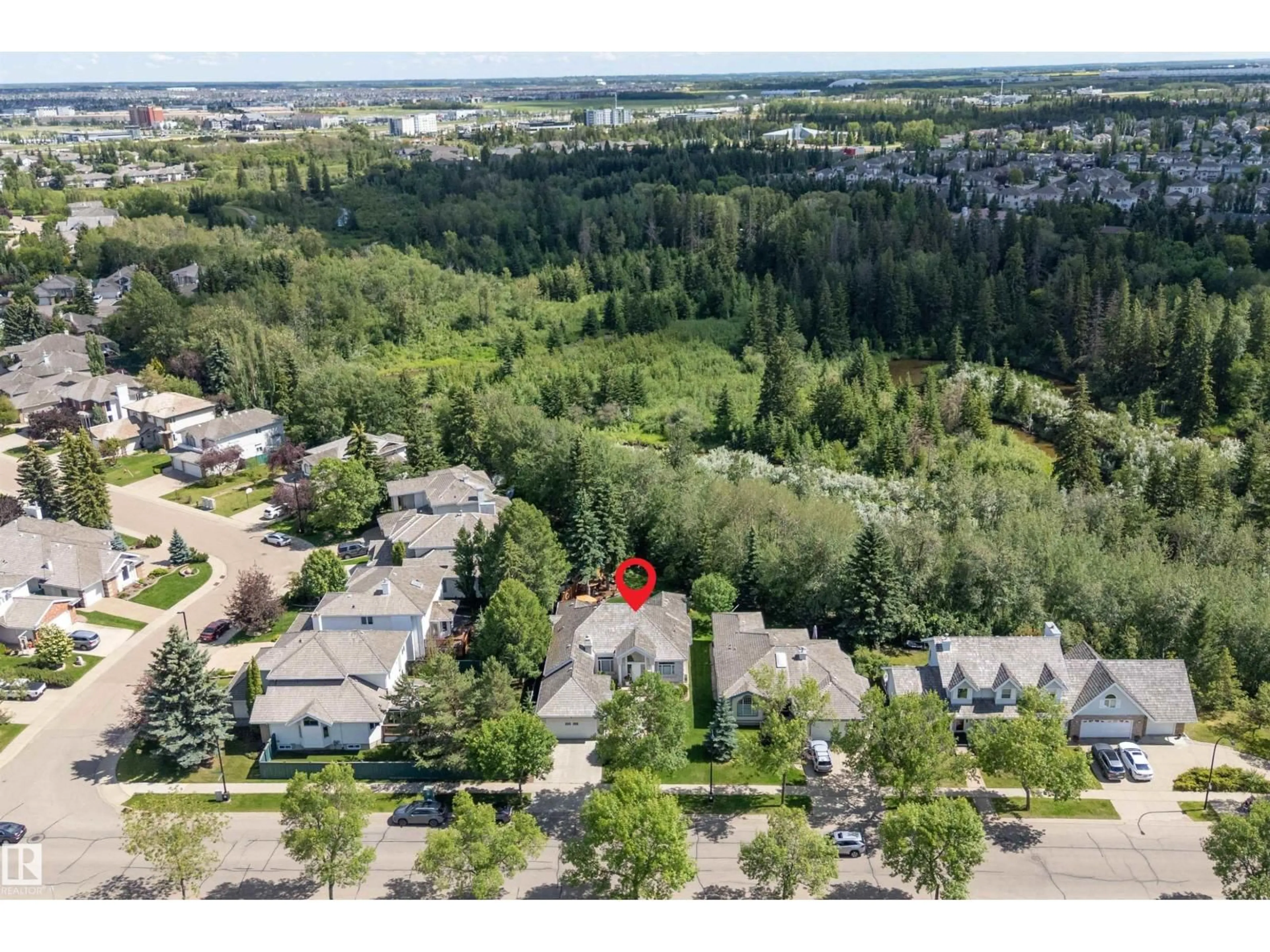 A pic from outside/outdoor area/front of a property/back of a property/a pic from drone, forest/trees view for 75 BLACKBURN DR, Edmonton Alberta T6W1A9