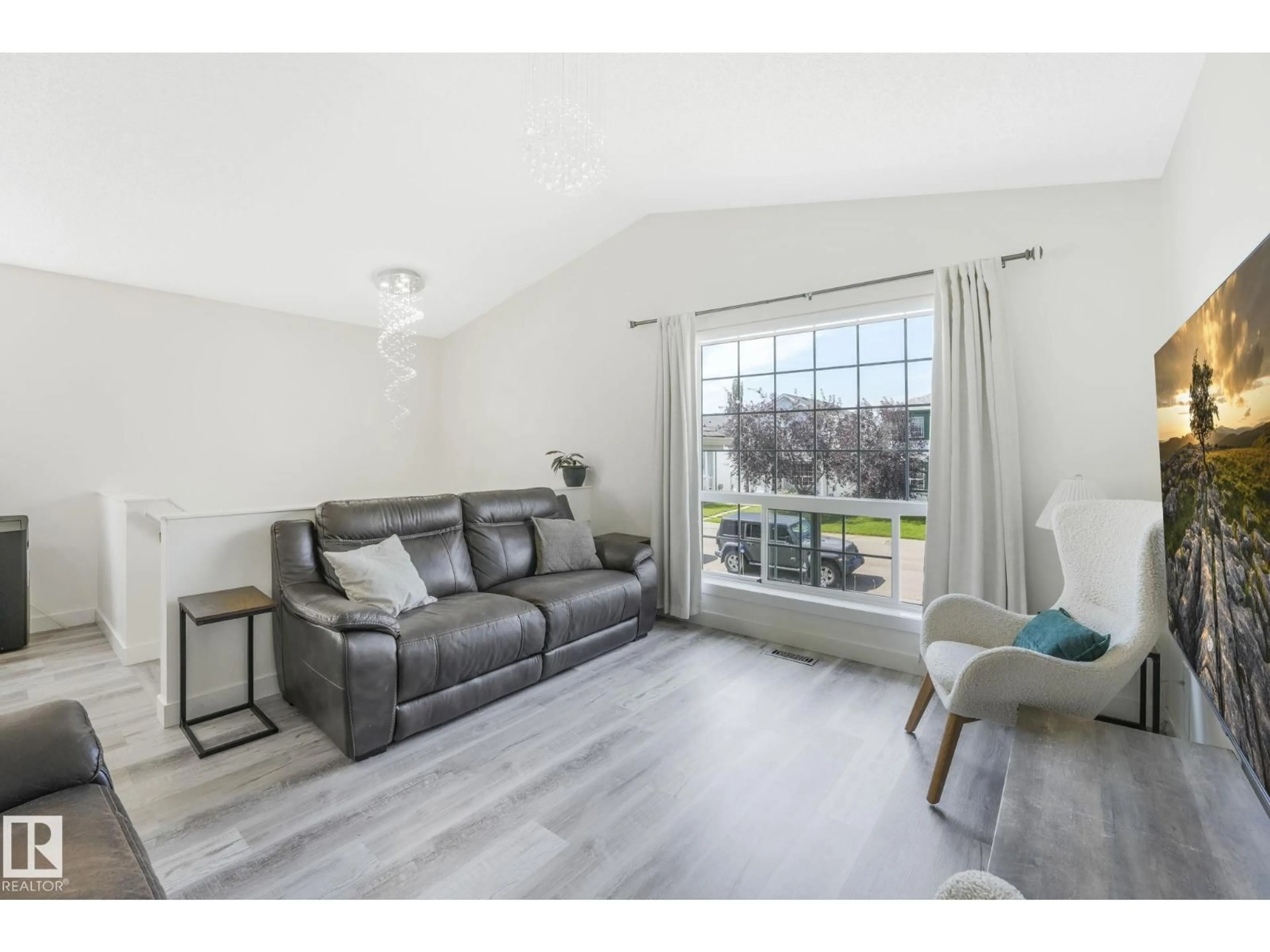 Living room with furniture, wood/laminate floor for NW - 15051 132 ST, Edmonton Alberta T6V1K8