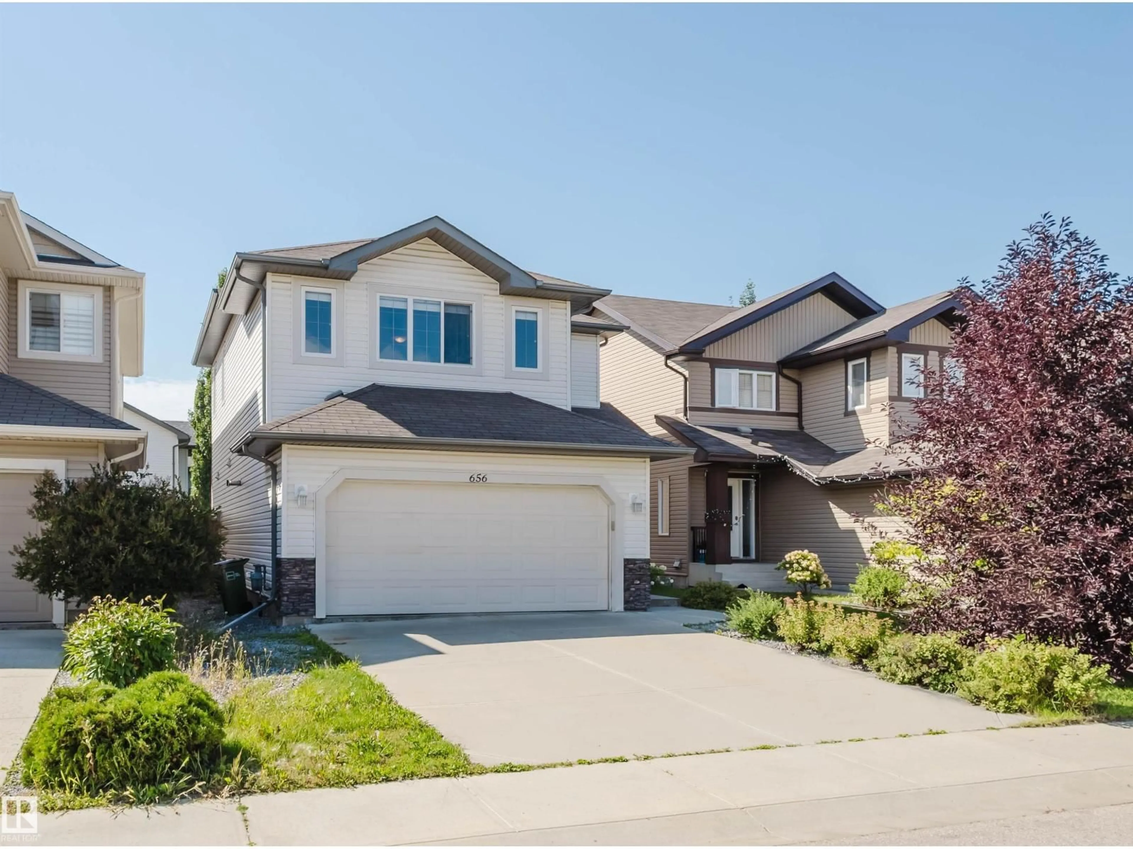 Home with vinyl exterior material, street for 656 171 ST, Edmonton Alberta T6W0M1