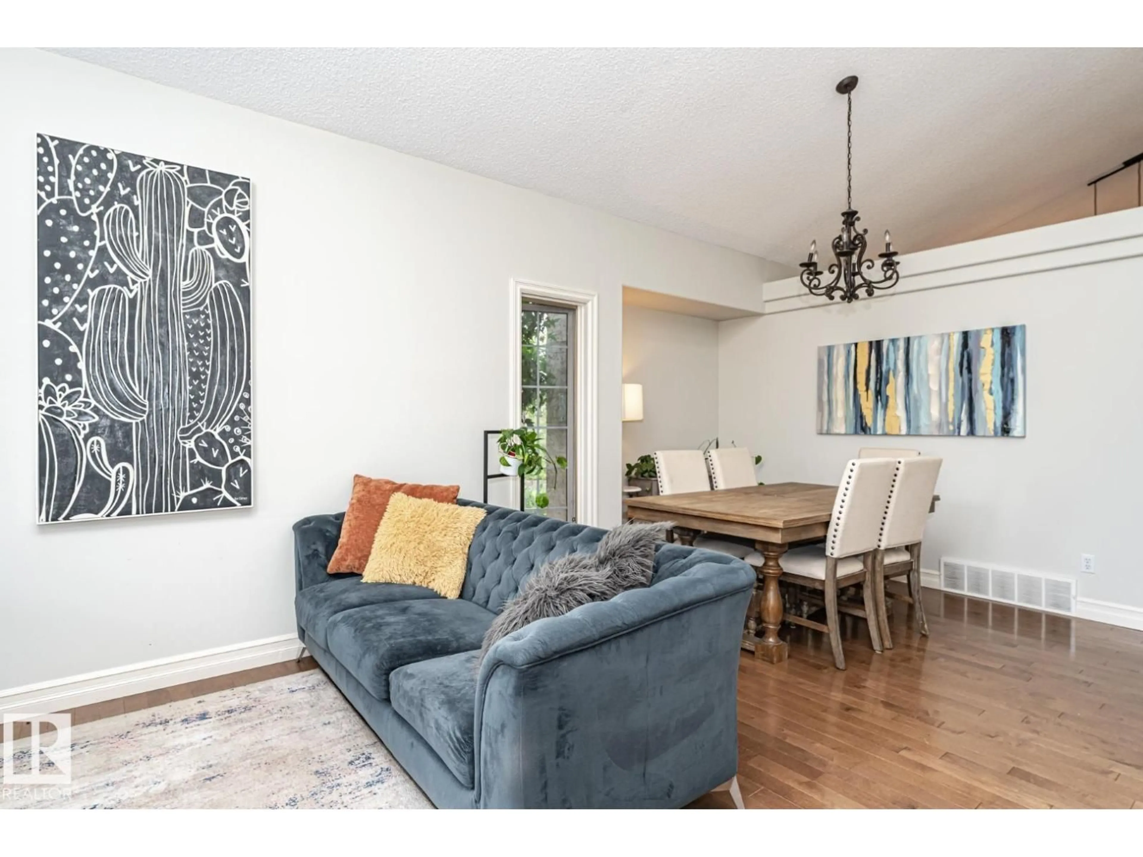 Living room with furniture, wood/laminate floor for 160 CARLSON CL, Edmonton Alberta T6R2J7