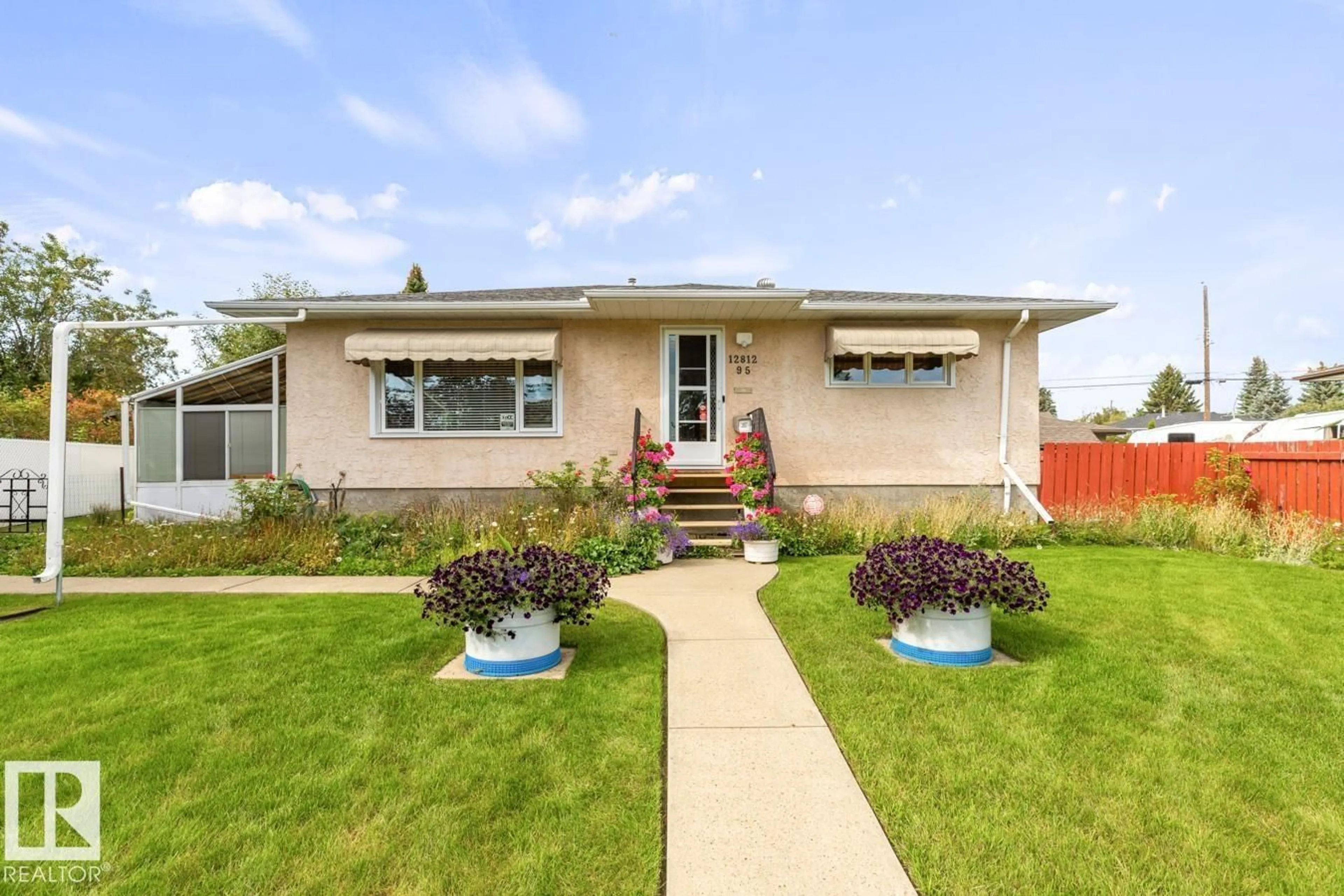 Home with vinyl exterior material, street for 12812 95 ST, Edmonton Alberta T5E3Y1