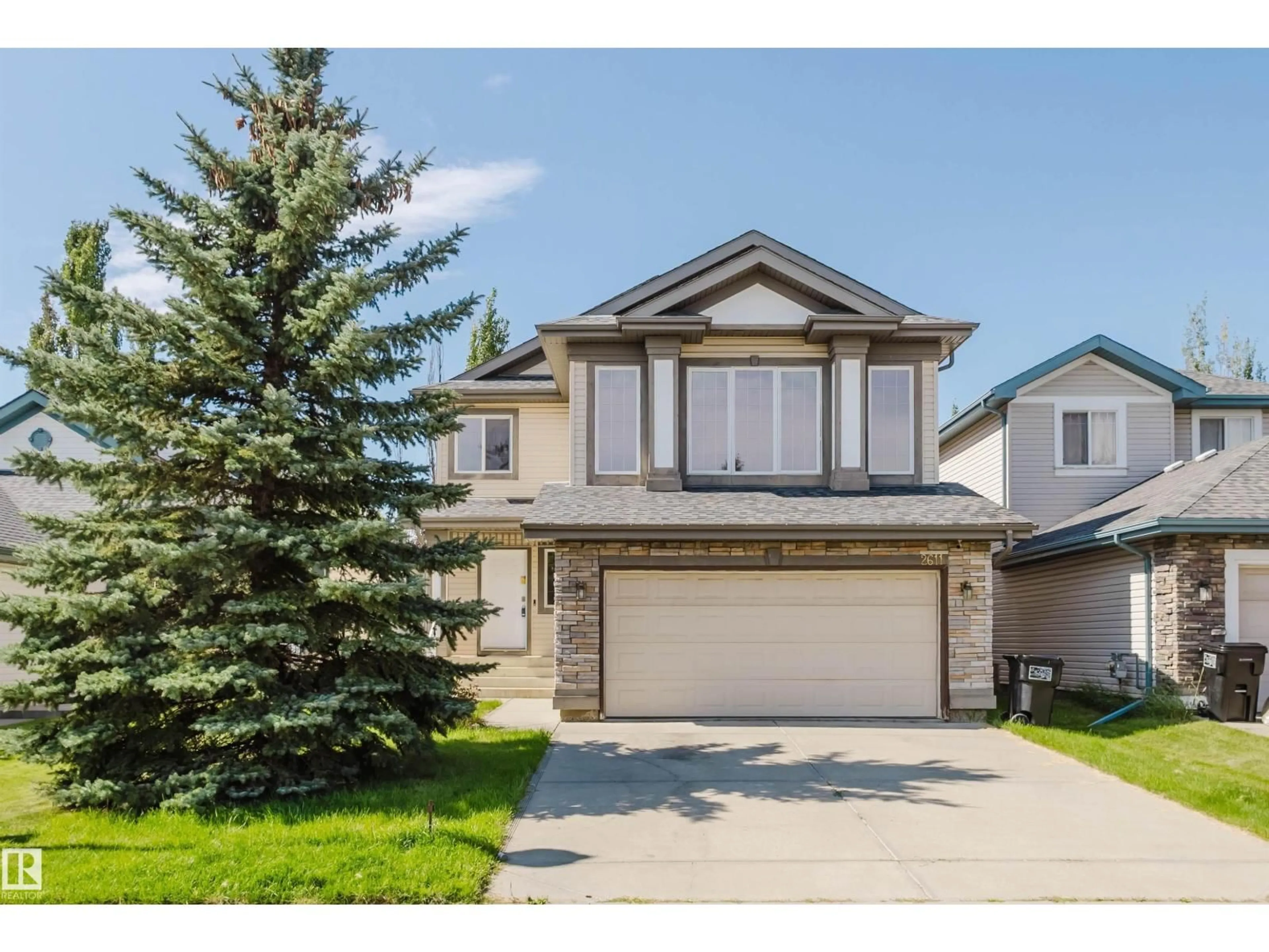 Home with vinyl exterior material, street for 2611 HANNA CR, Edmonton Alberta T6R3C9