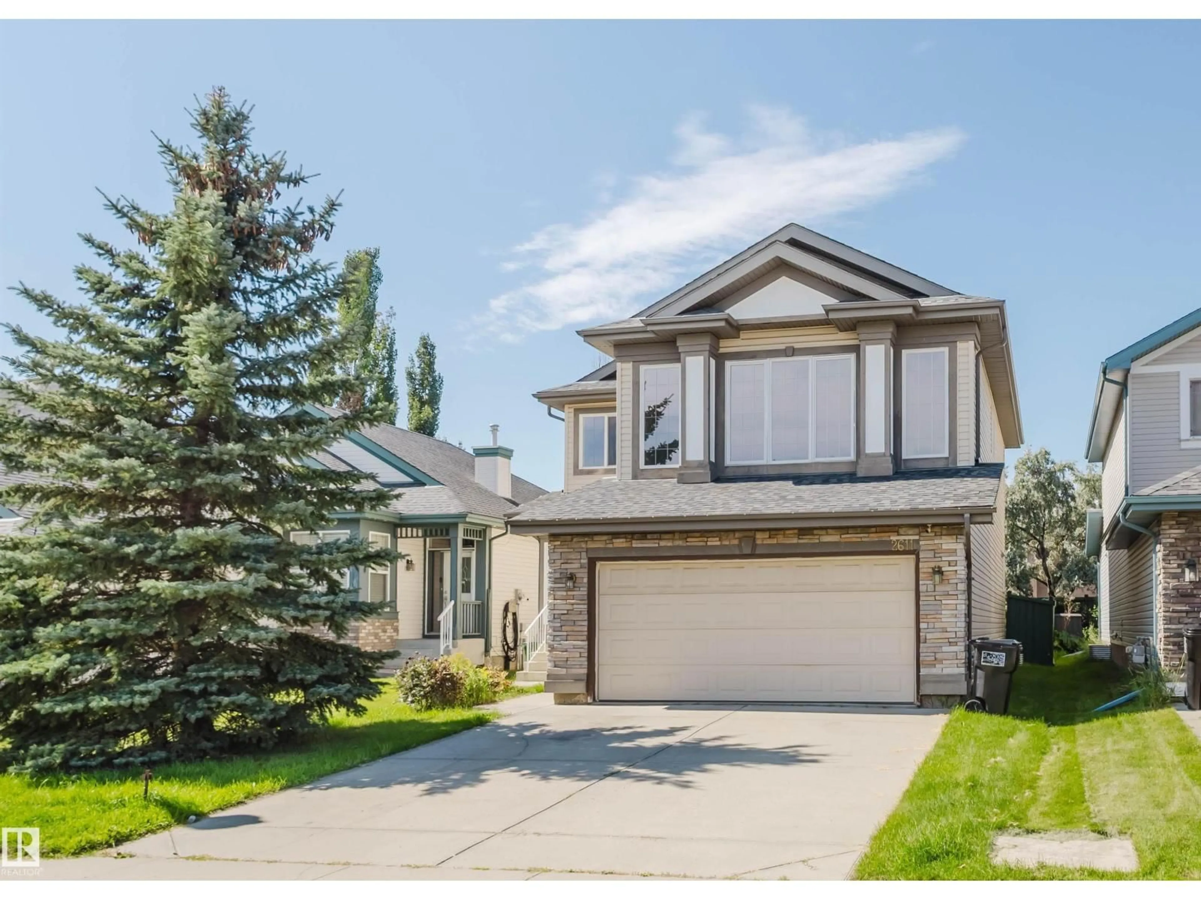 Home with vinyl exterior material, street for 2611 HANNA CR, Edmonton Alberta T6R3C9