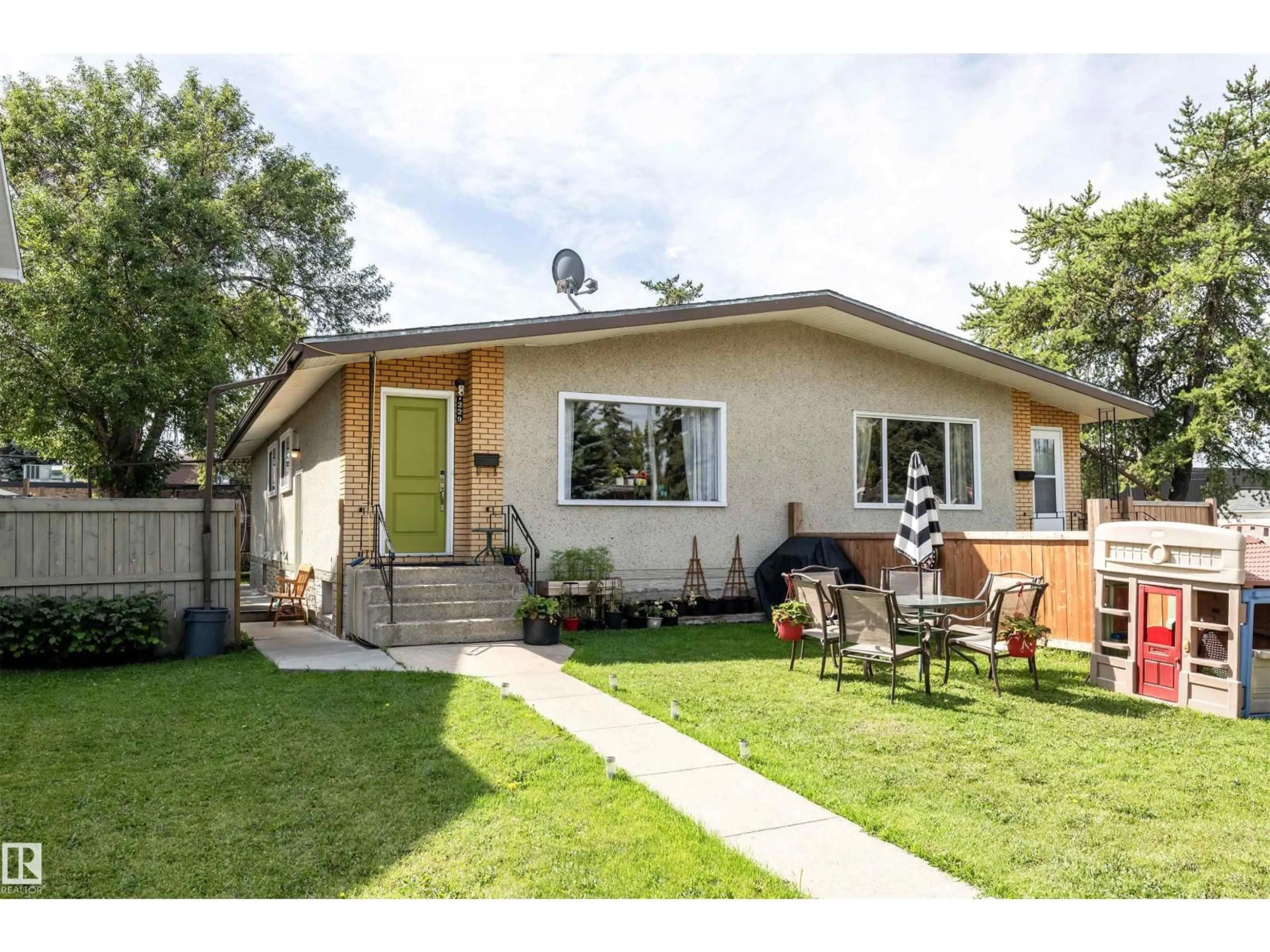 Home with vinyl exterior material, street for NW - 7229 83 AV, Edmonton Alberta T6B0G7