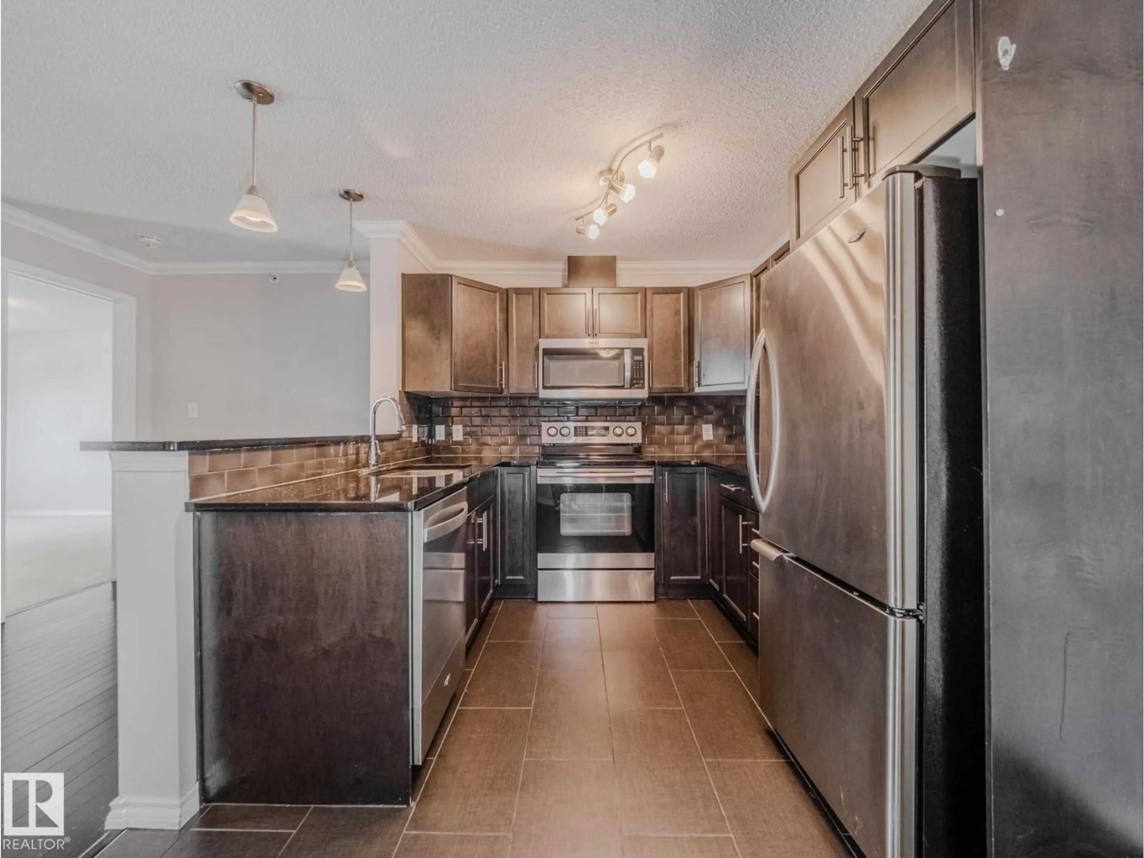 Open concept kitchen, ceramic/tile floor for #434 - 2436 GUARDIAN RD, Edmonton Alberta T5T2P5