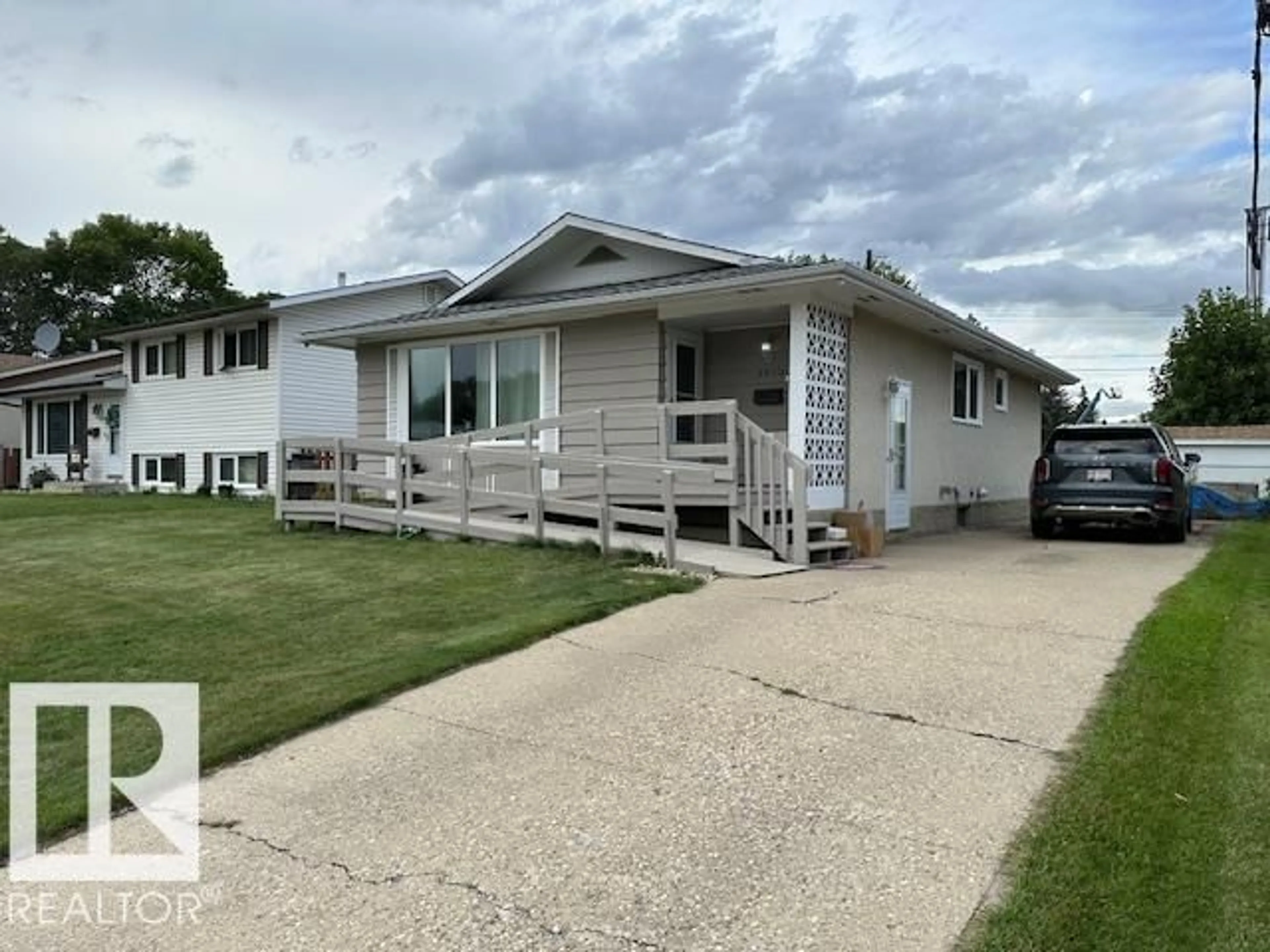 Home with vinyl exterior material, street for 3512 114 AV, Edmonton Alberta T5W0S3