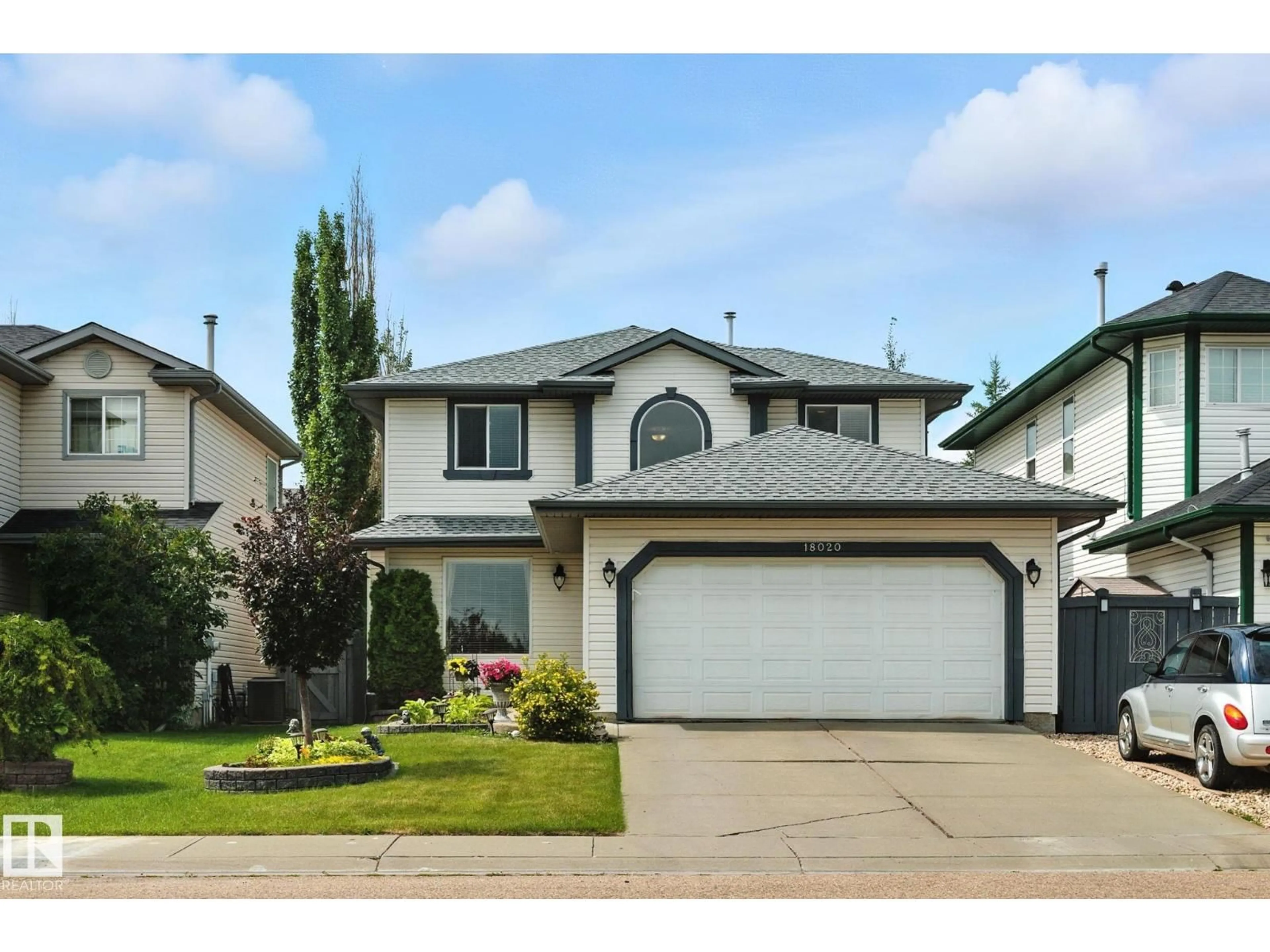 Home with vinyl exterior material, street for 18020 101 ST NW, Edmonton Alberta T5X5Z8