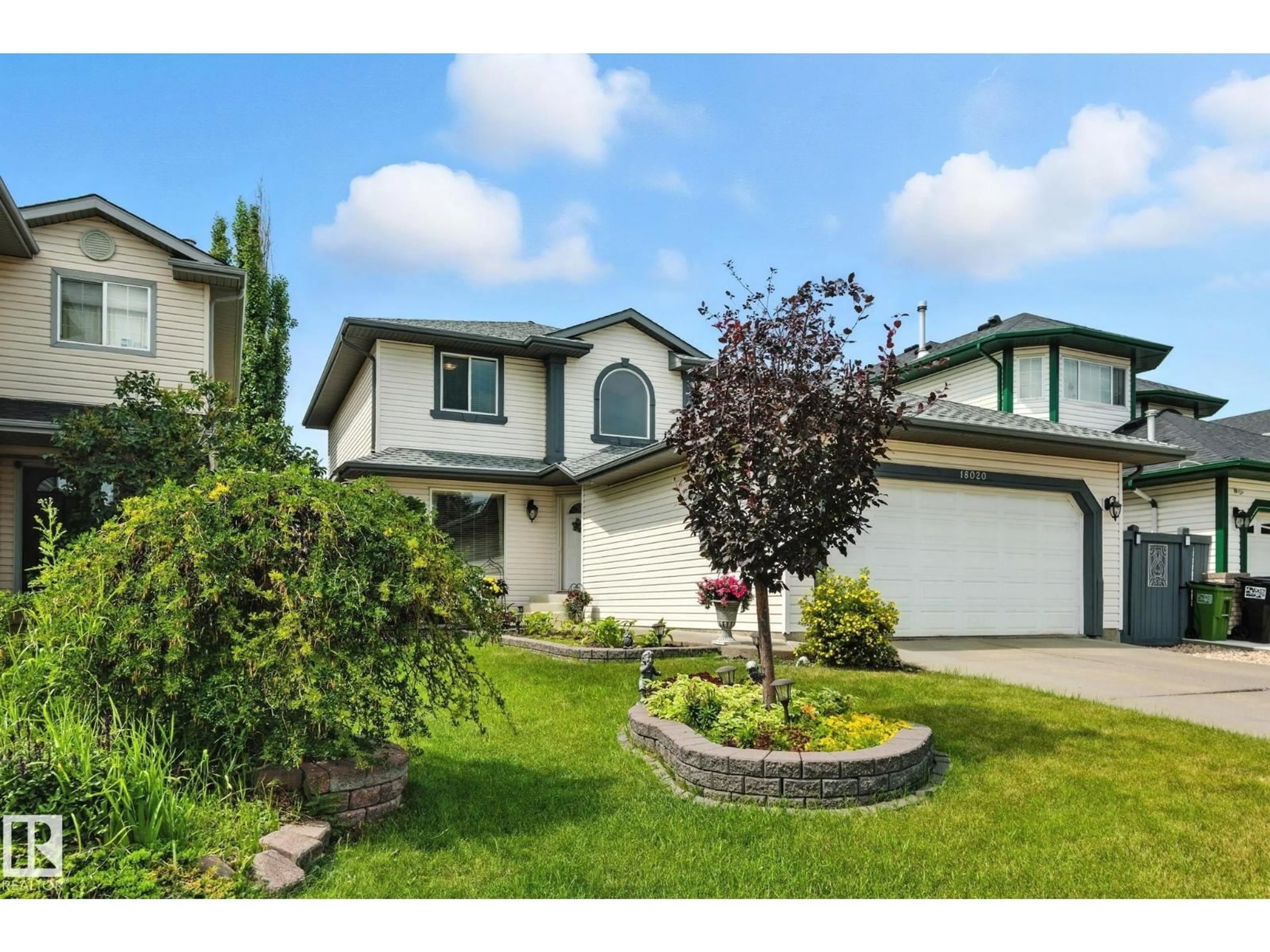 Home with vinyl exterior material, street for 18020 101 ST NW, Edmonton Alberta T5X5Z8