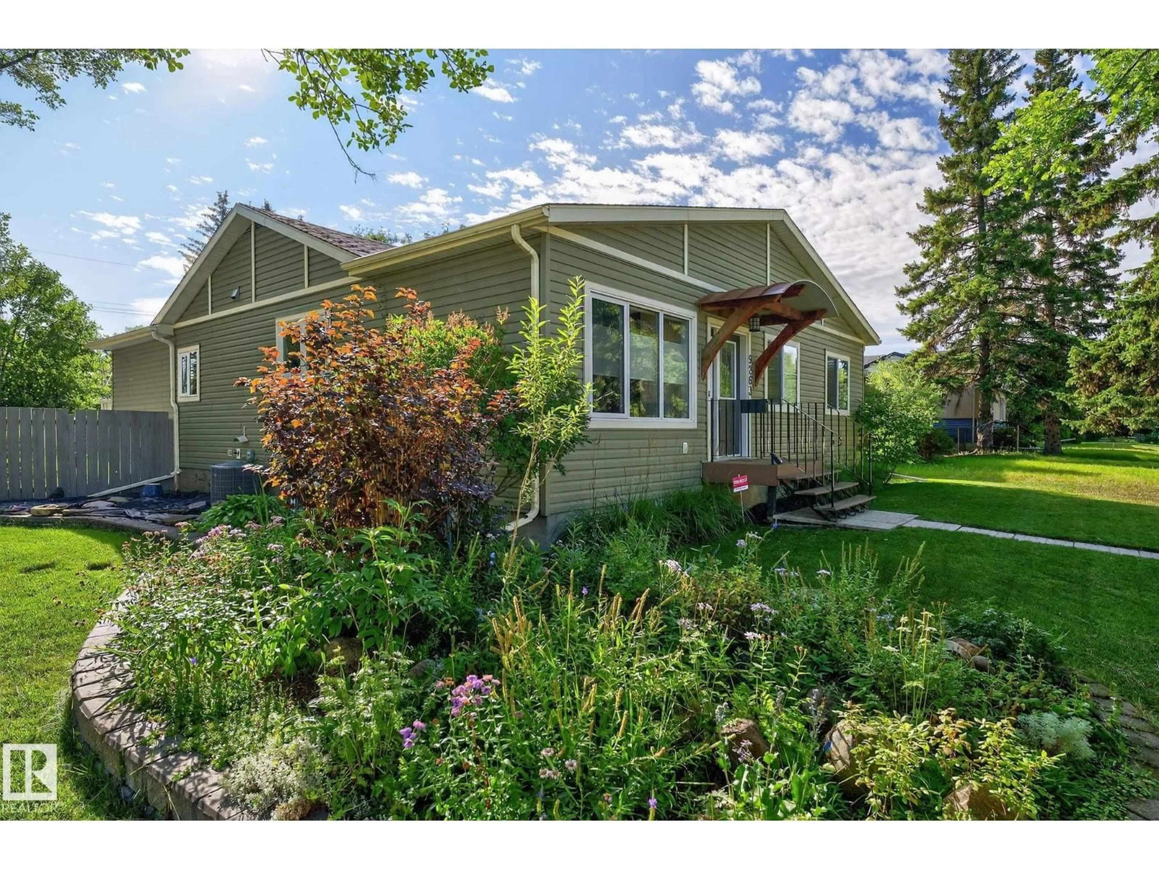 Home with vinyl exterior material, street for 9263 77 ST, Edmonton Alberta T6C2M2