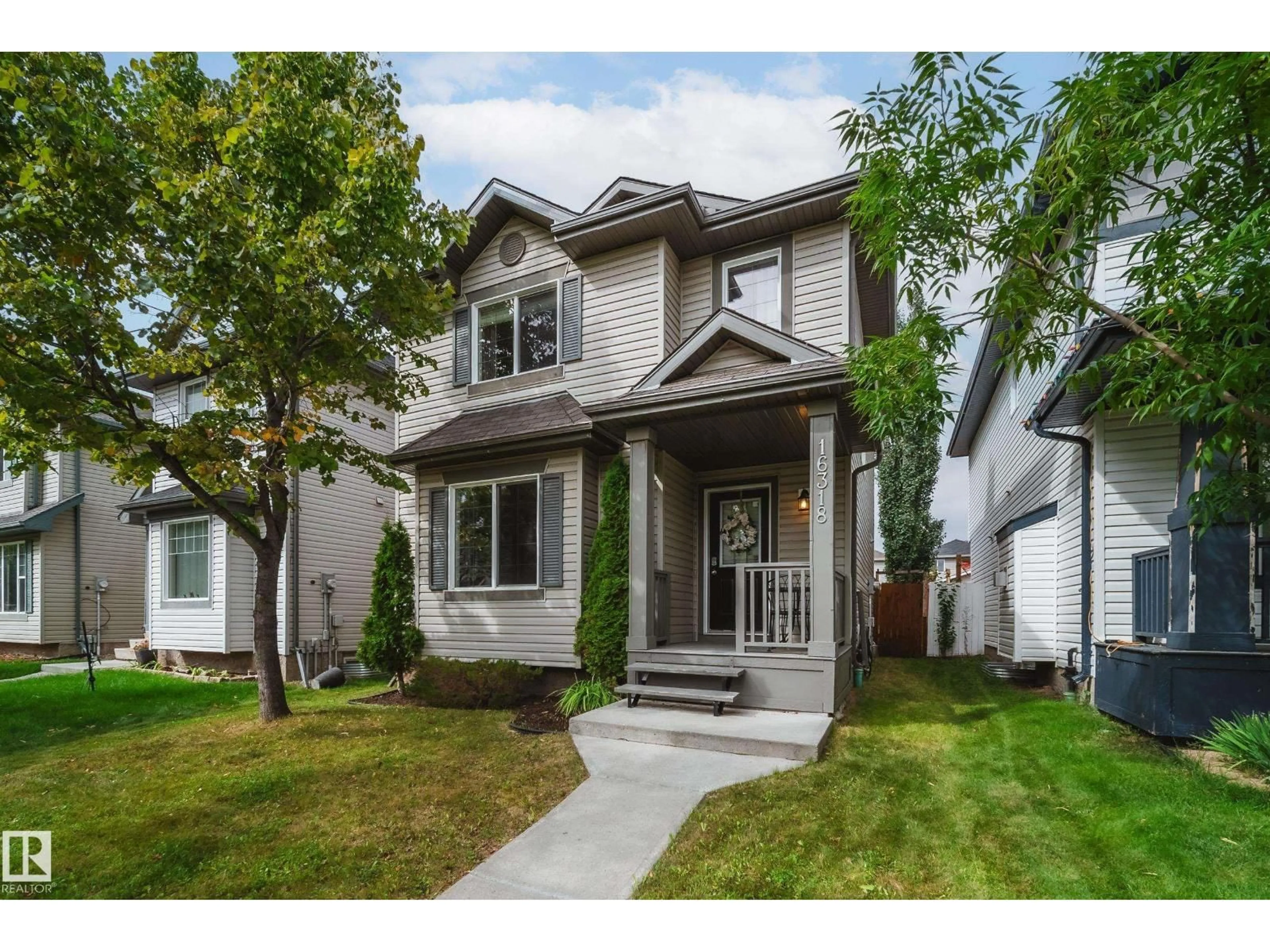 Home with vinyl exterior material, street for NW - 16318 57 ST, Edmonton Alberta T5Y0A1
