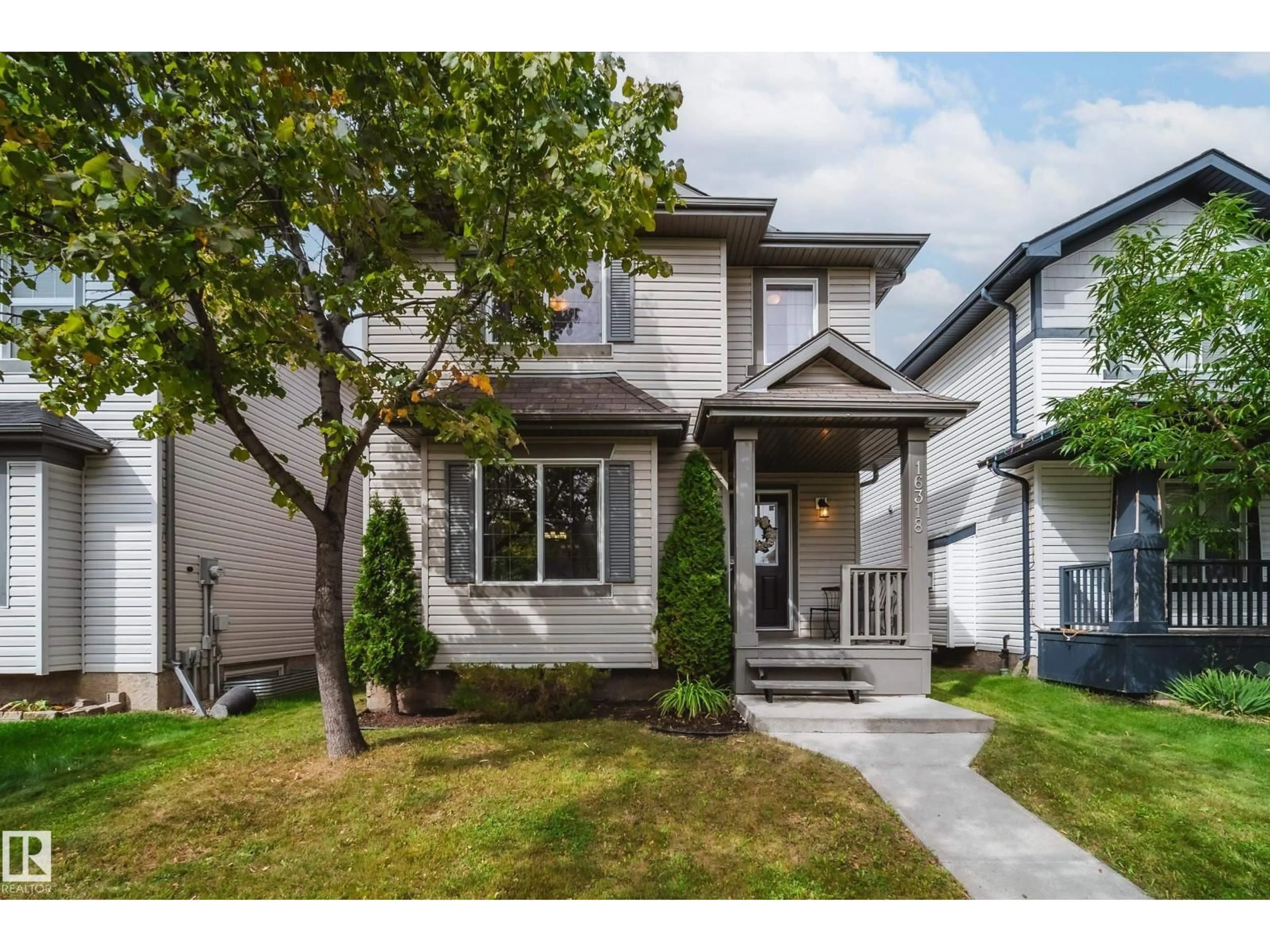 Home with vinyl exterior material, street for NW - 16318 57 ST, Edmonton Alberta T5Y0A1