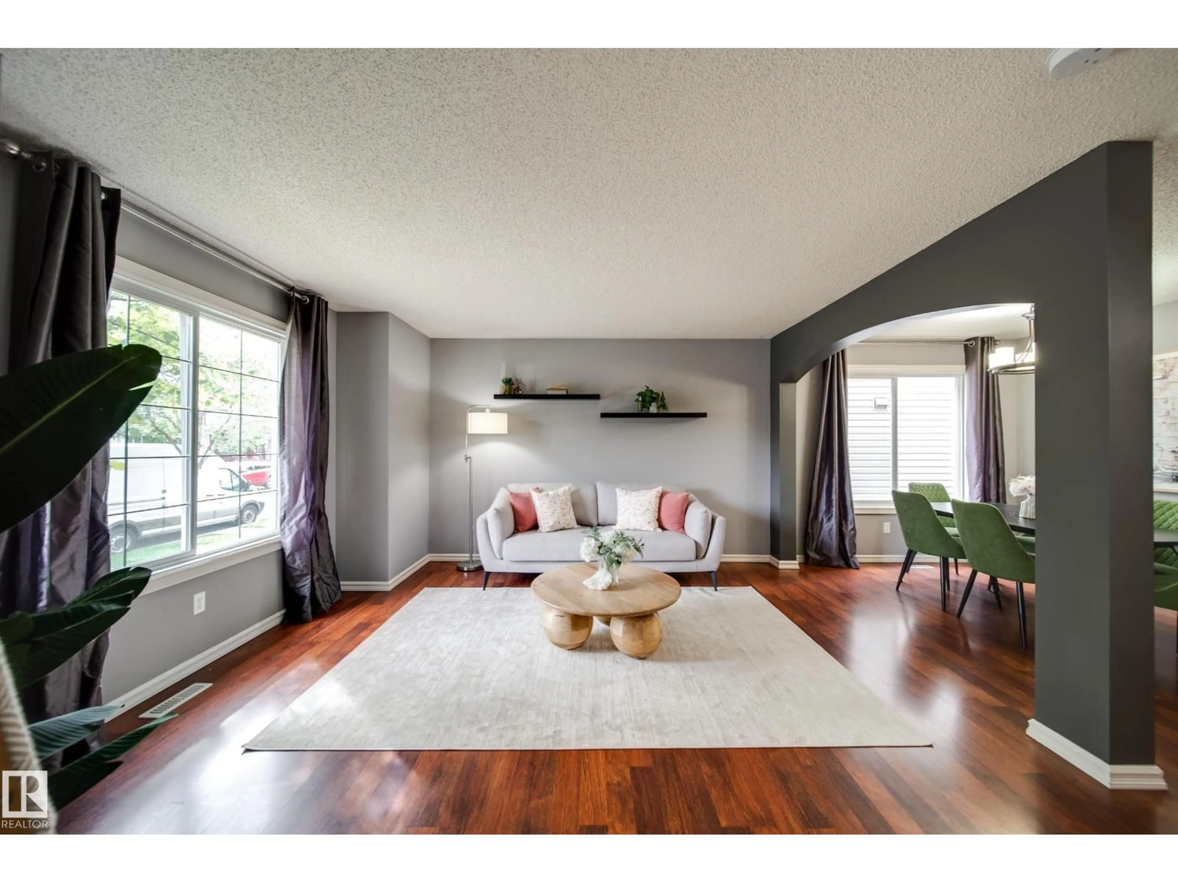 Living room with furniture, wood/laminate floor for NW - 16318 57 ST, Edmonton Alberta T5Y0A1