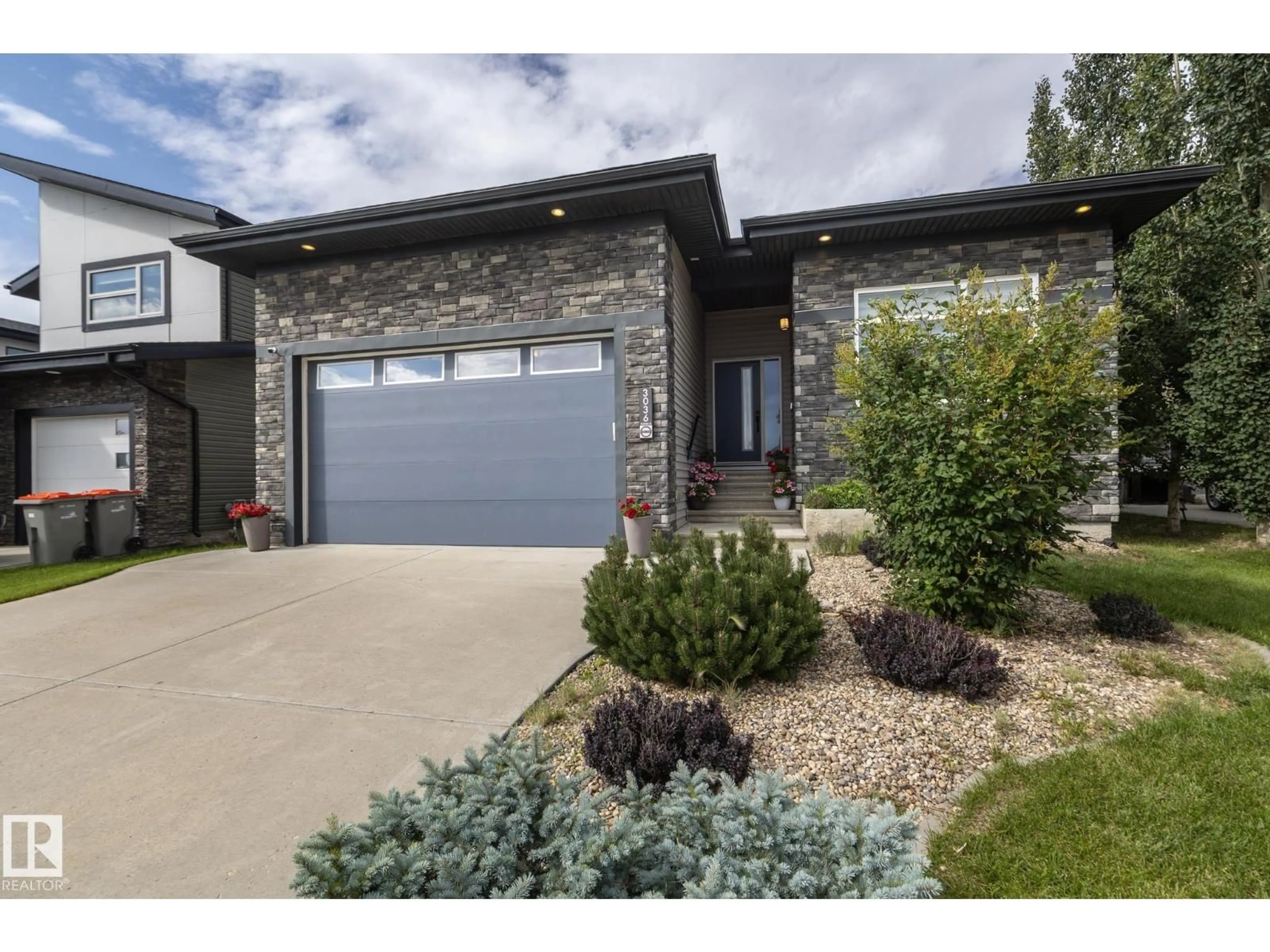 Home with brick exterior material, street for NE - 3036 58 AV, Rural Leduc County Alberta T4X0X9