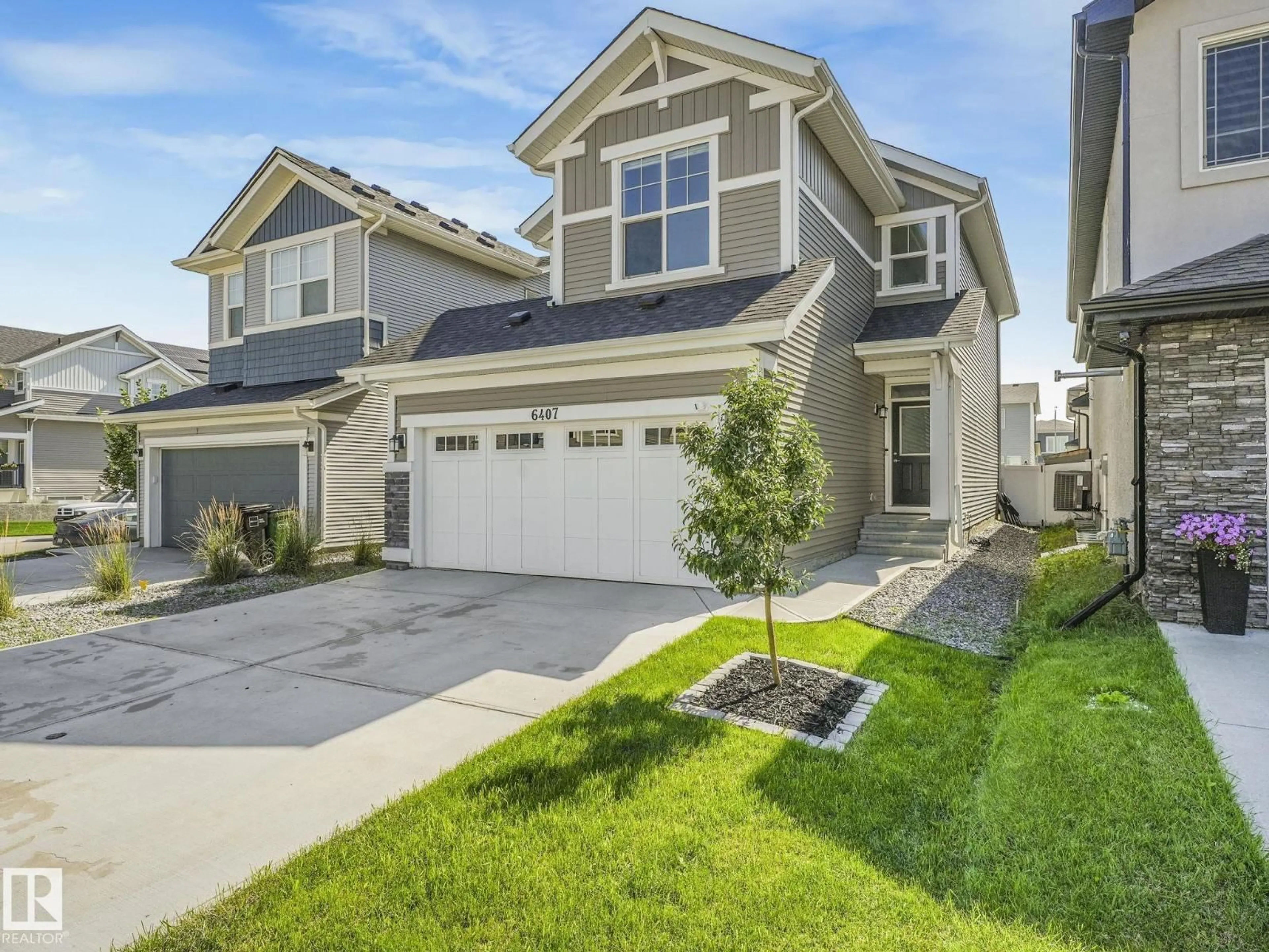 Home with vinyl exterior material, street for NW - 6407 174 AV, Edmonton Alberta T5Y3T6