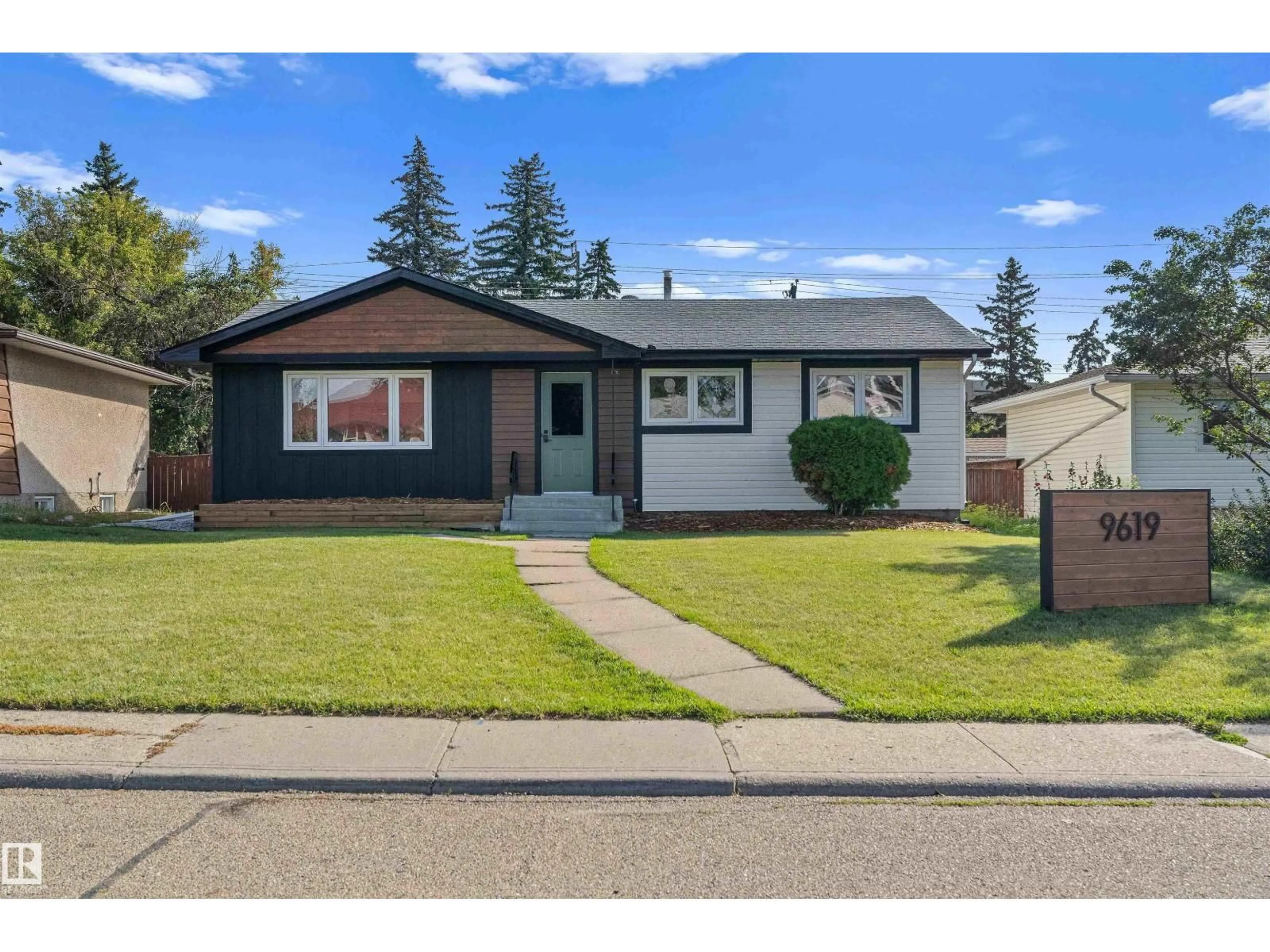Home with vinyl exterior material, street for 9619 52 ST, Edmonton Alberta T6B1G8