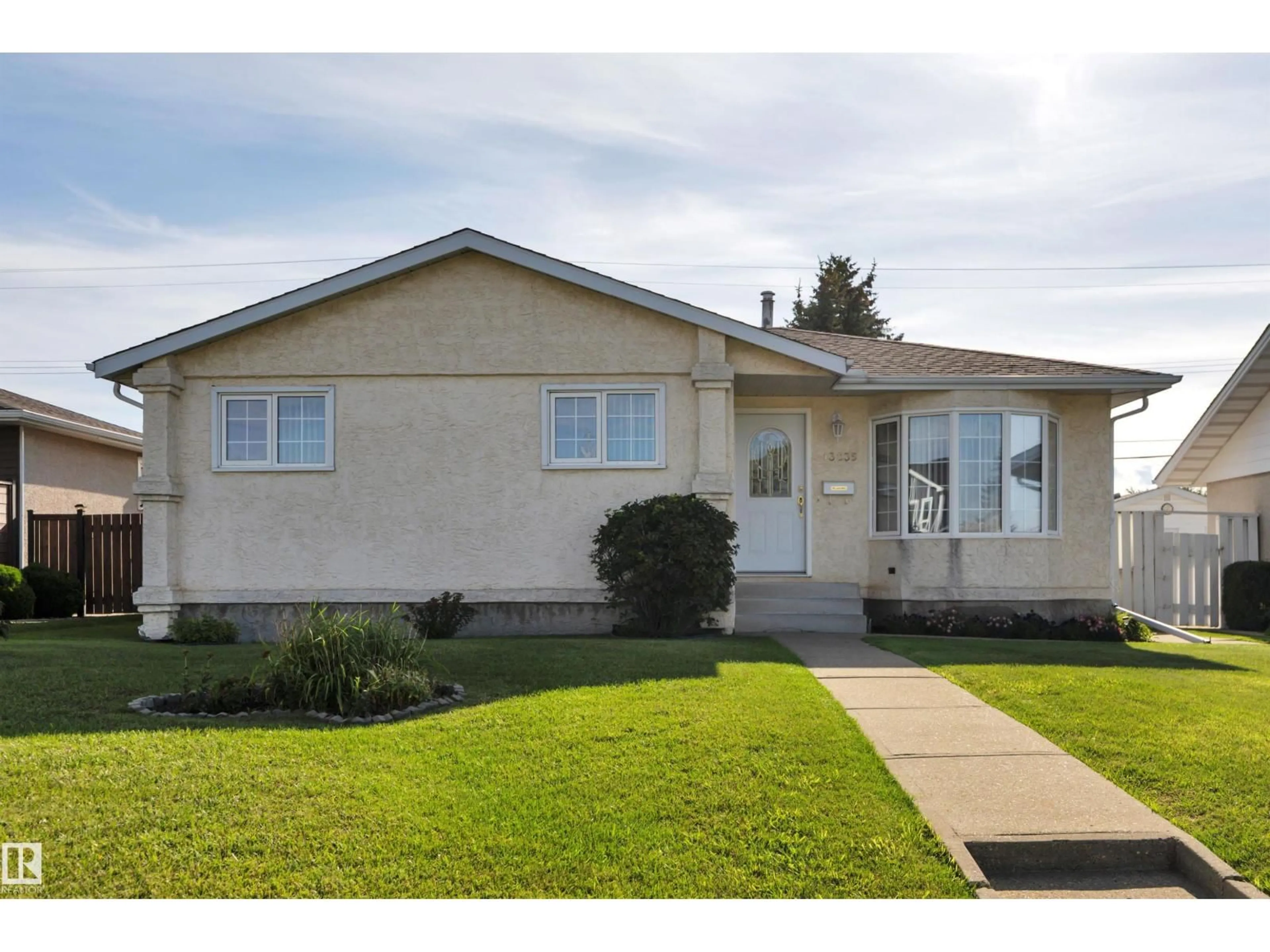 Home with vinyl exterior material, street for 13235 94 ST, Edmonton Alberta T5E3V7