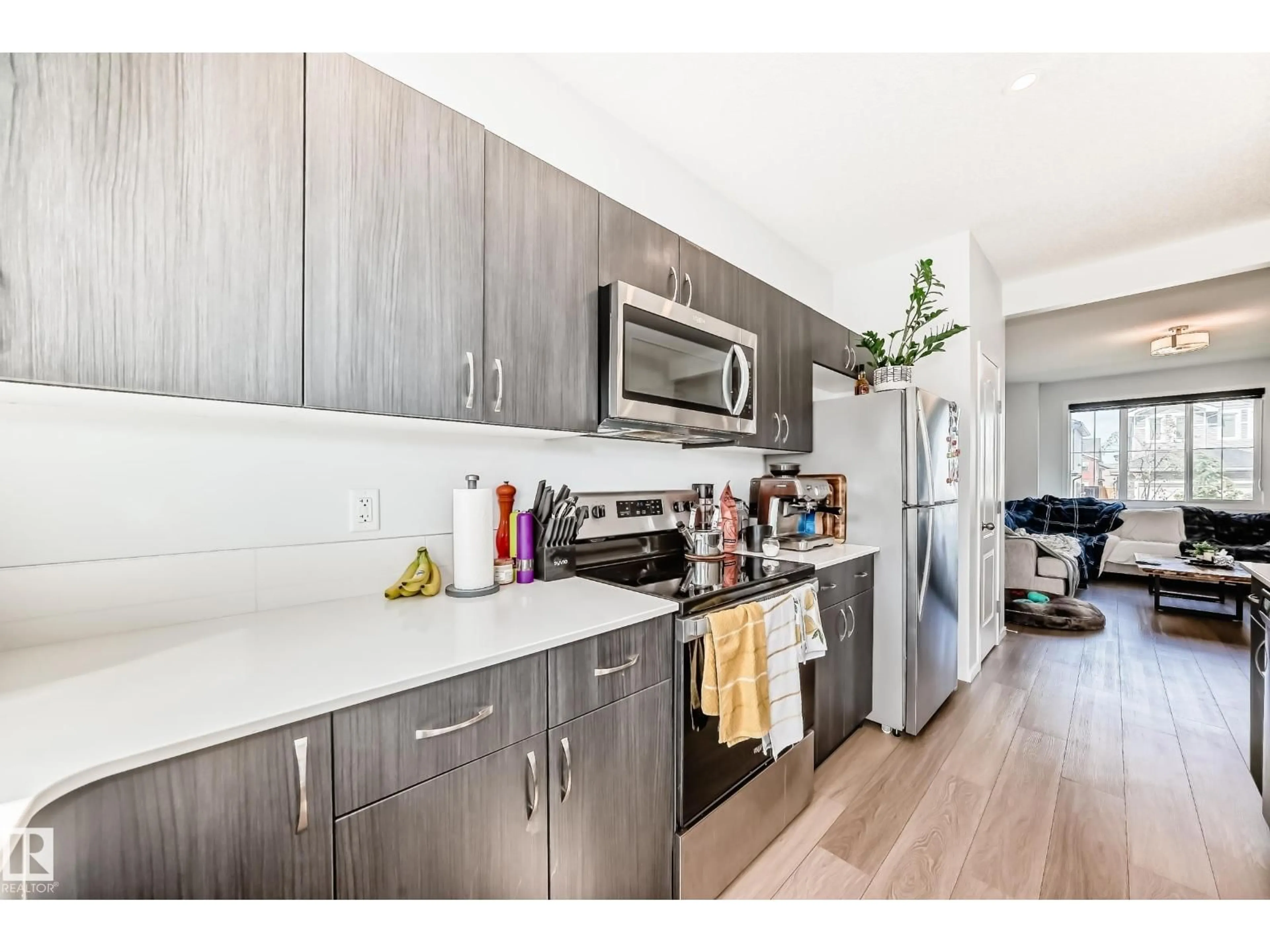 Open concept kitchen, wood/laminate floor for 5309 22 AV, Edmonton Alberta T6X0H6