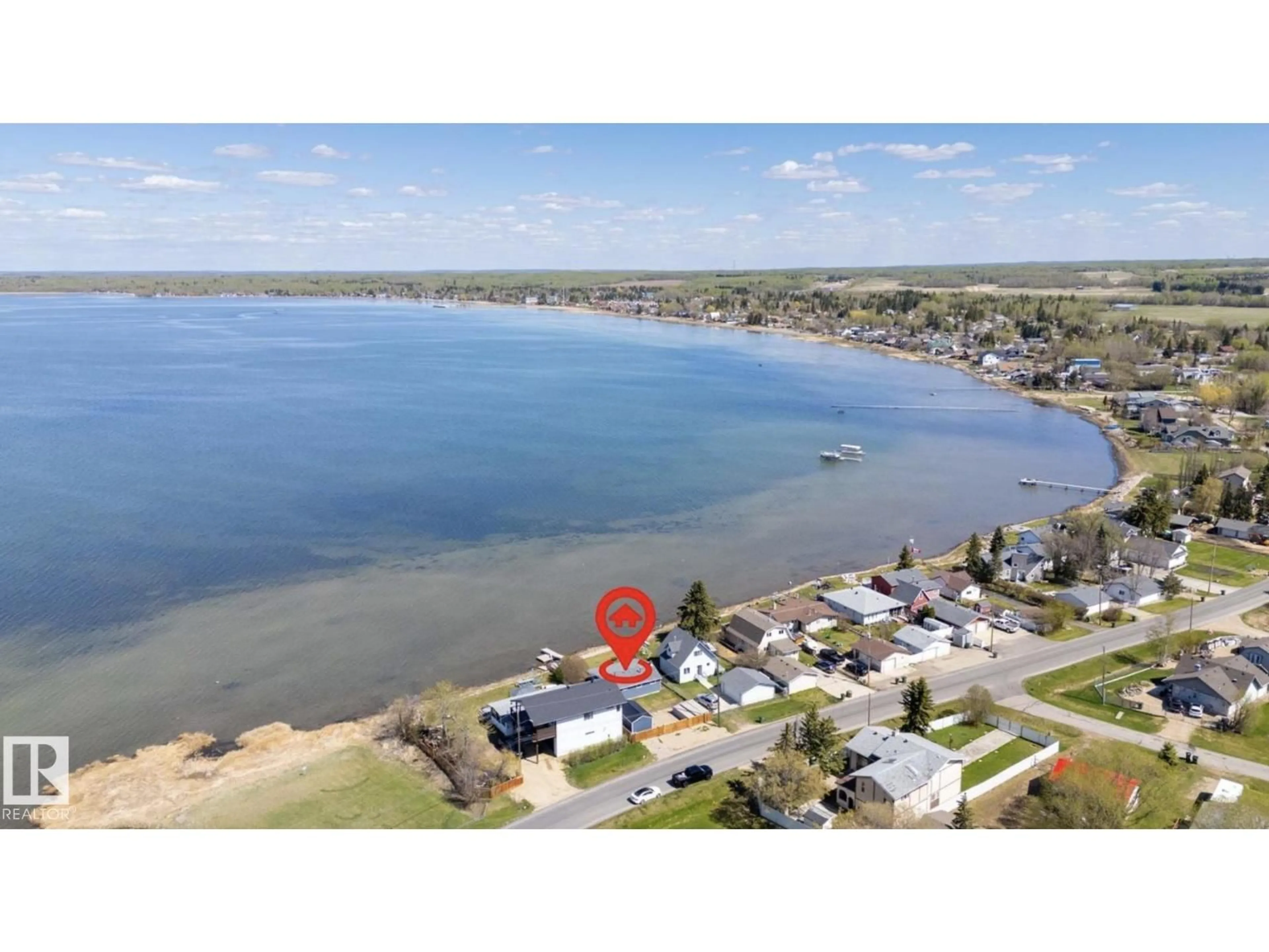 A pic from outside/outdoor area/front of a property/back of a property/a pic from drone, water/lake/river/ocean view for 6330 STE ANNE TRAIL, Rural Lac Ste. Anne County Alberta T0E0A0