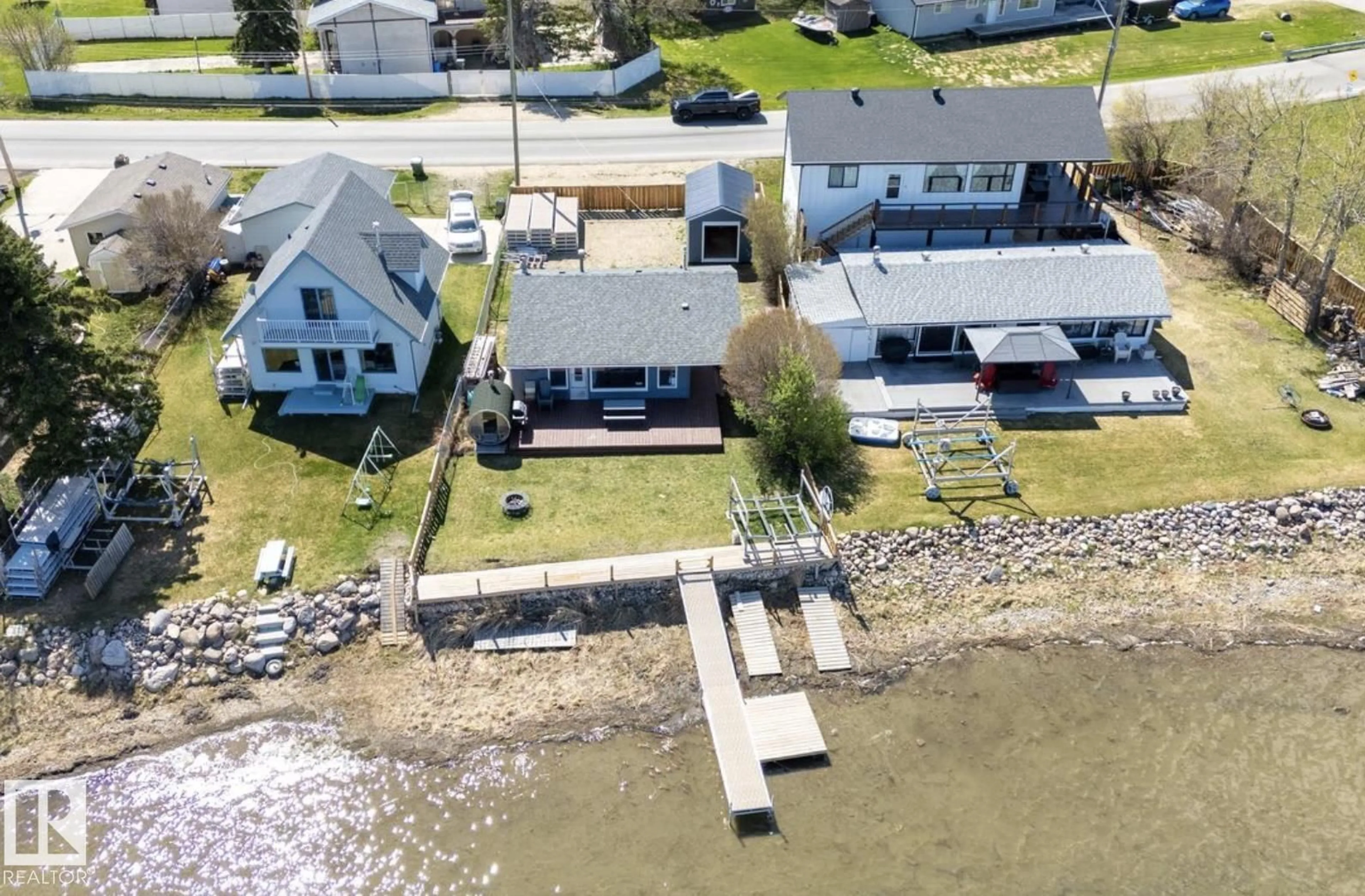 A pic from outside/outdoor area/front of a property/back of a property/a pic from drone, water/lake/river/ocean view for 6330 STE ANNE TRAIL, Rural Lac Ste. Anne County Alberta T0E0A0