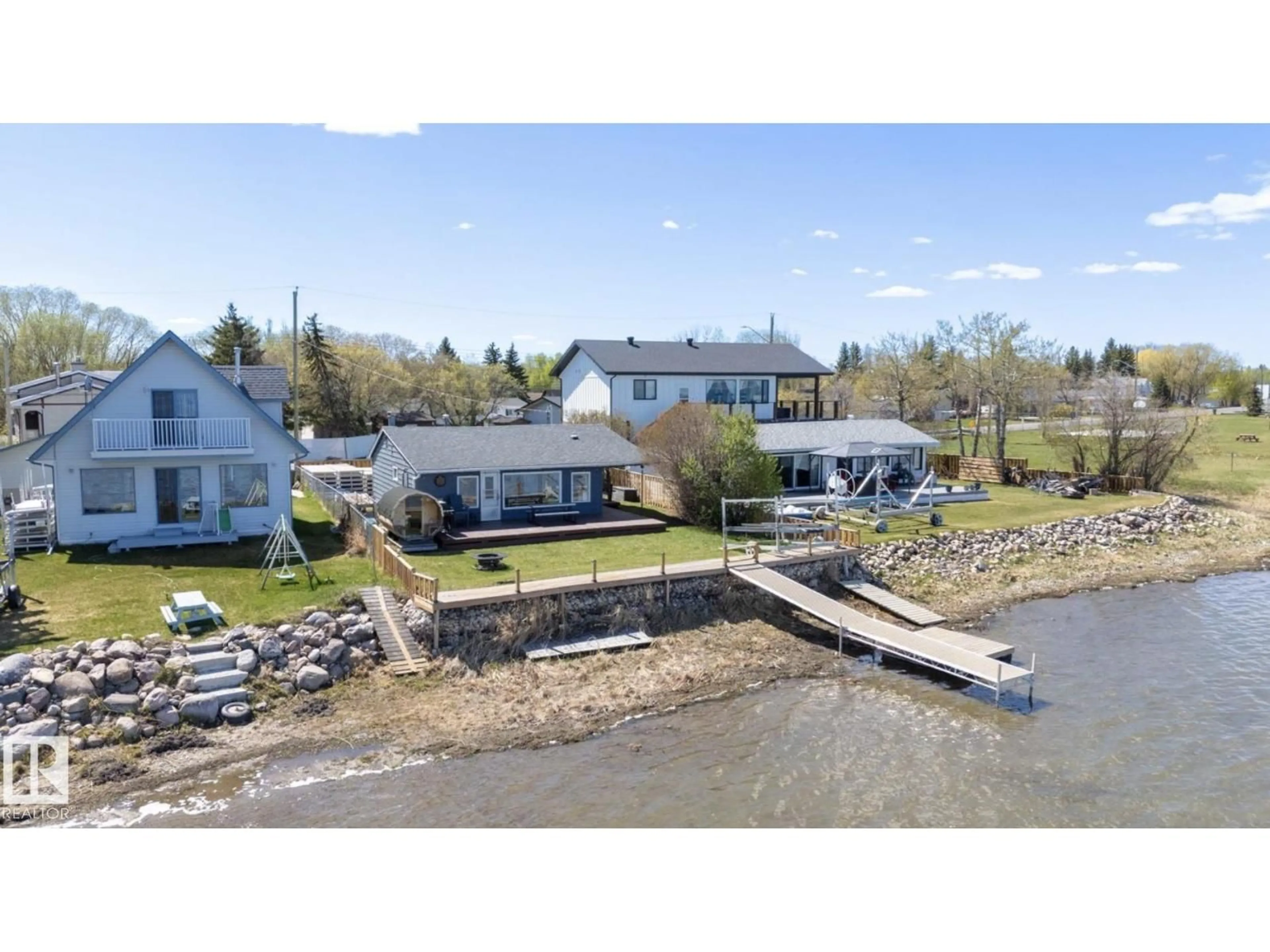 A pic from outside/outdoor area/front of a property/back of a property/a pic from drone, water/lake/river/ocean view for 6330 STE ANNE TRAIL, Rural Lac Ste. Anne County Alberta T0E0A0