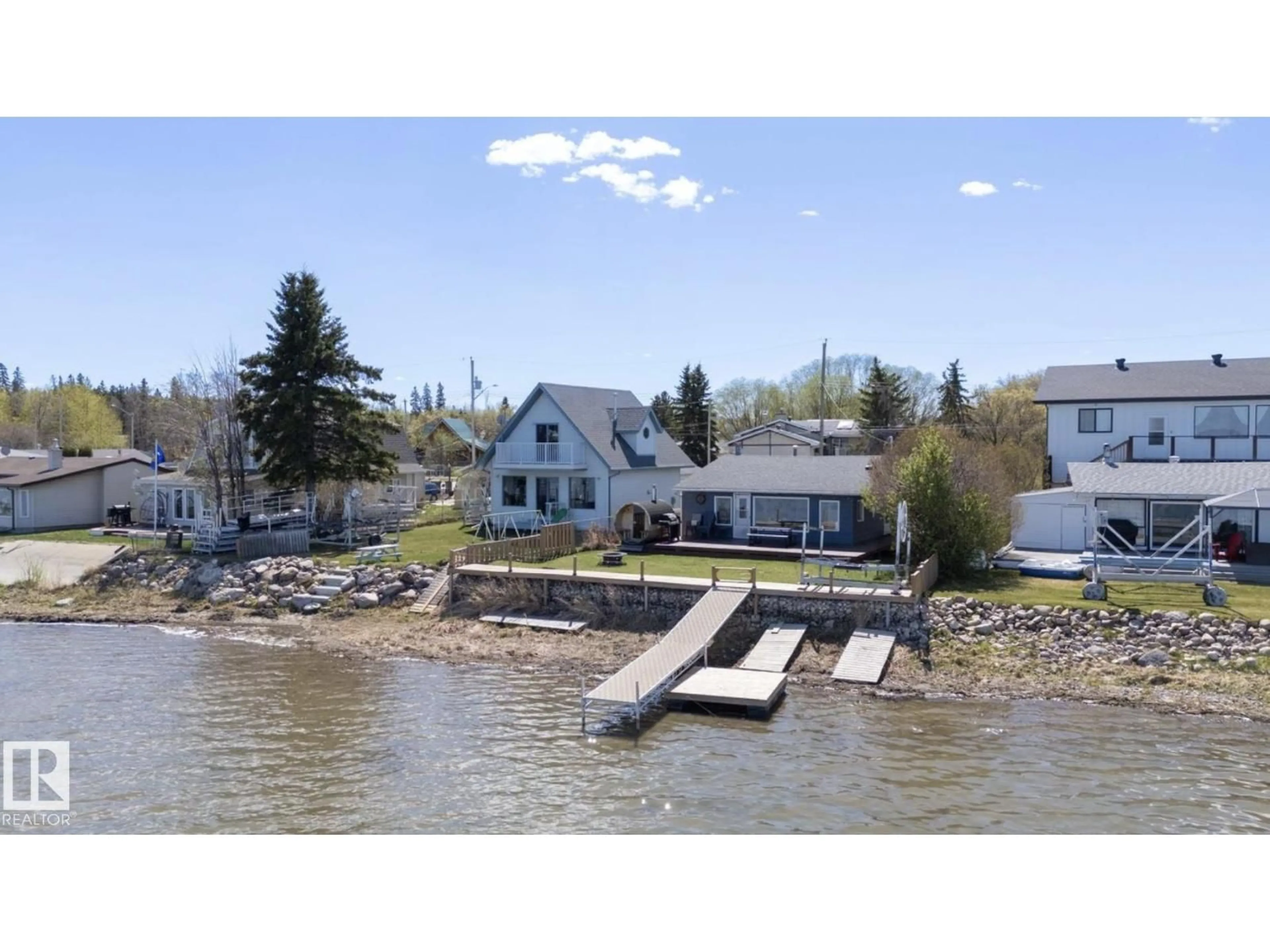 A pic from outside/outdoor area/front of a property/back of a property/a pic from drone, water/lake/river/ocean view for 6330 STE ANNE TRAIL, Rural Lac Ste. Anne County Alberta T0E0A0