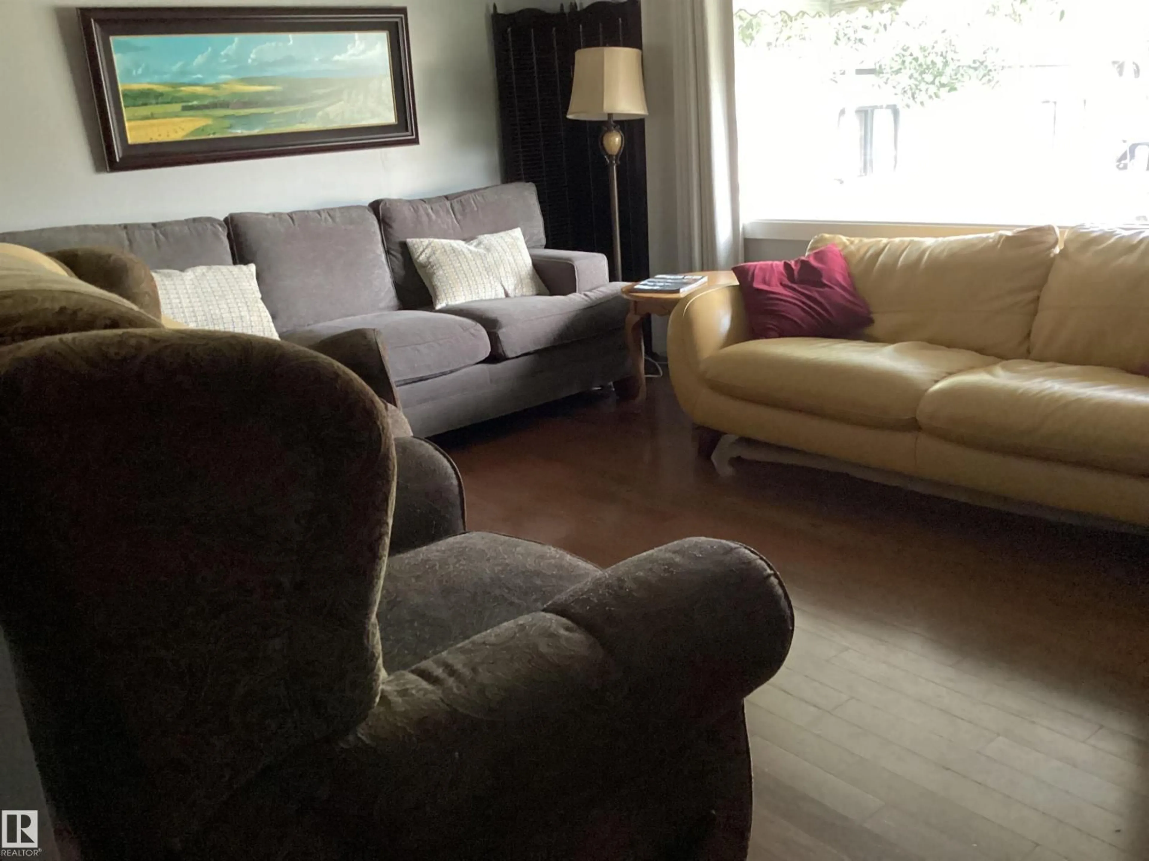 Living room with furniture, wood/laminate floor for NW - 9135 155 ST, Edmonton Alberta T5R1W6