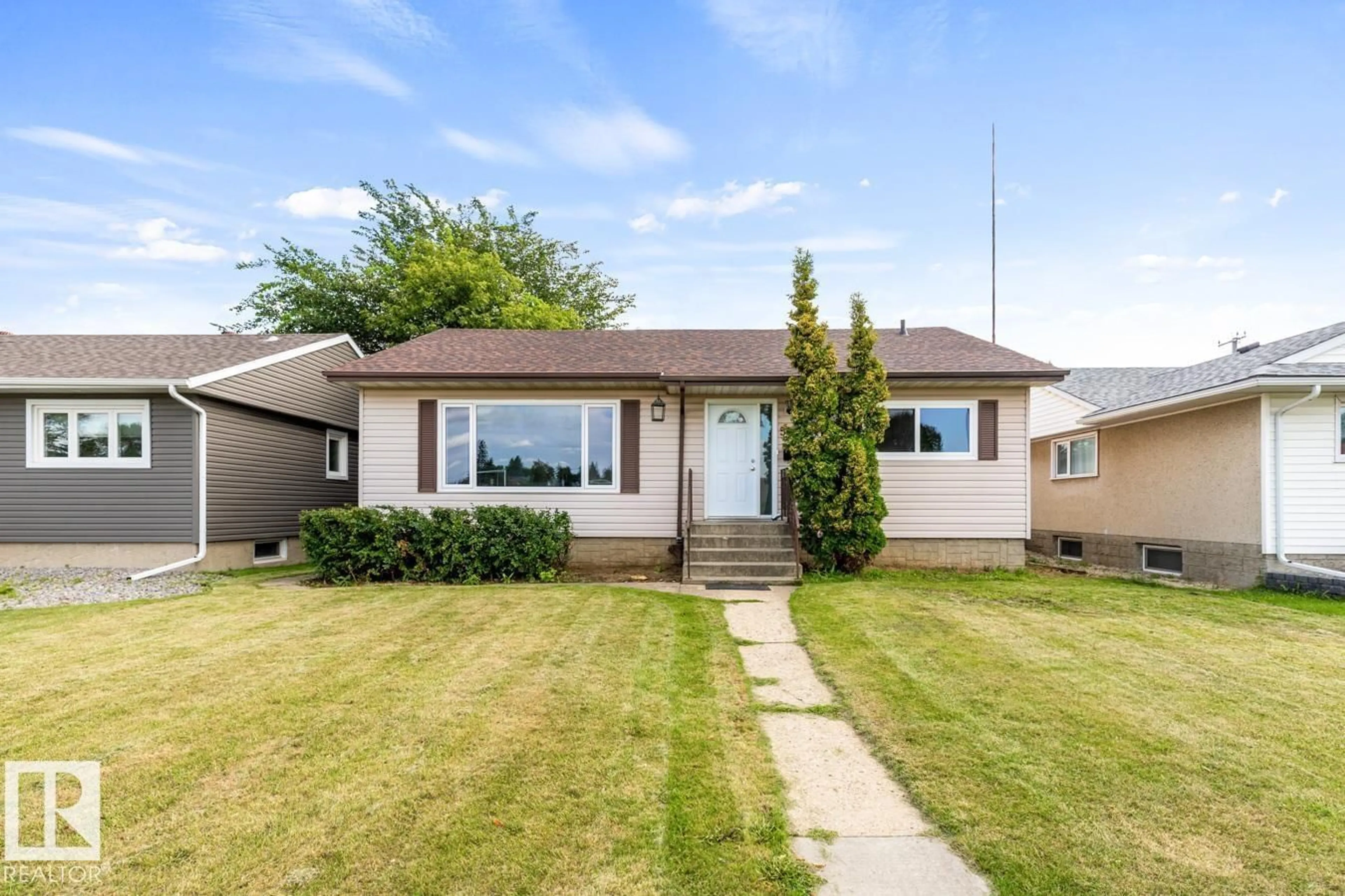 Home with vinyl exterior material, street for 5403 106 AV, Edmonton Alberta T6A1G1