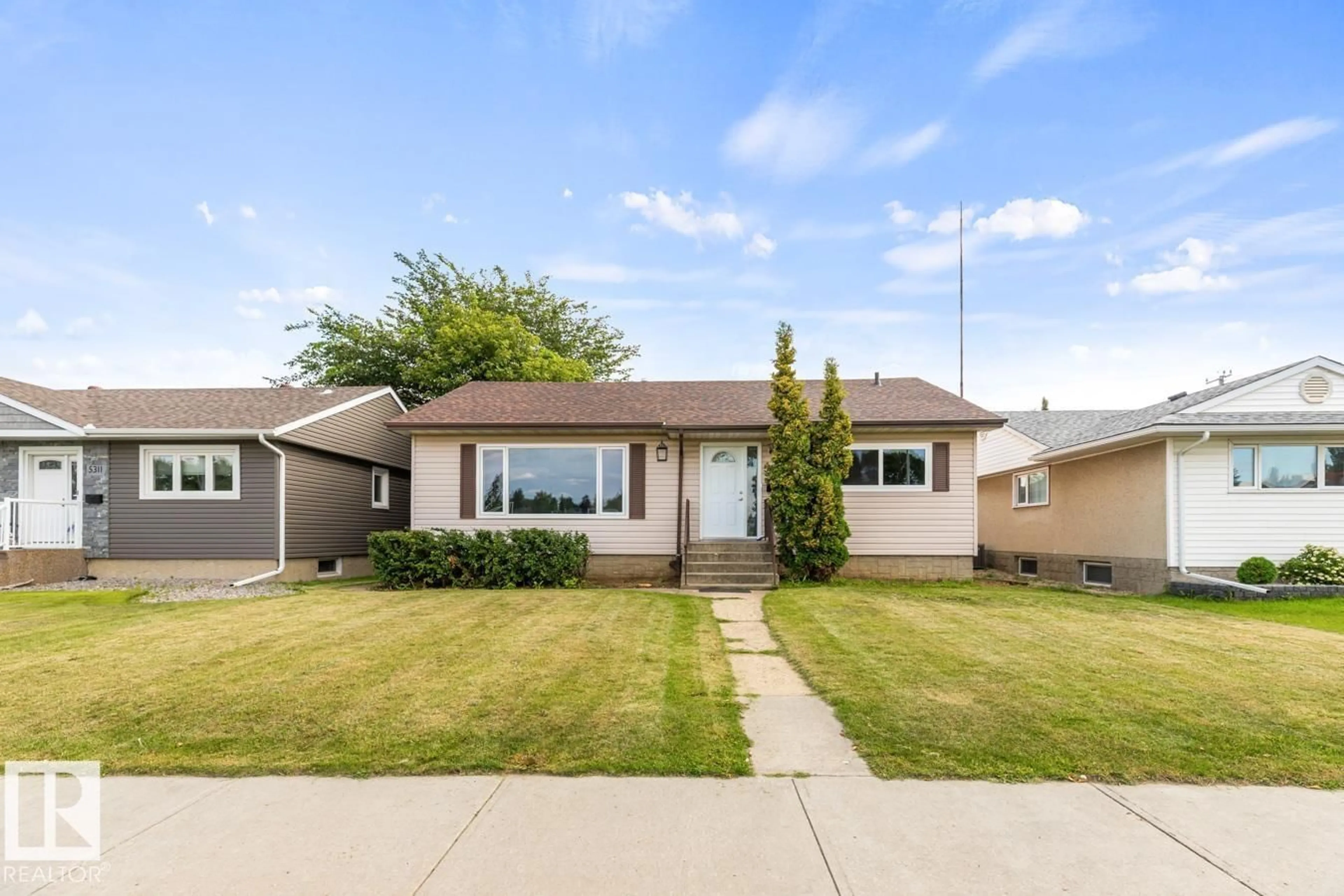 Home with vinyl exterior material, street for 5403 106 AV, Edmonton Alberta T6A1G1