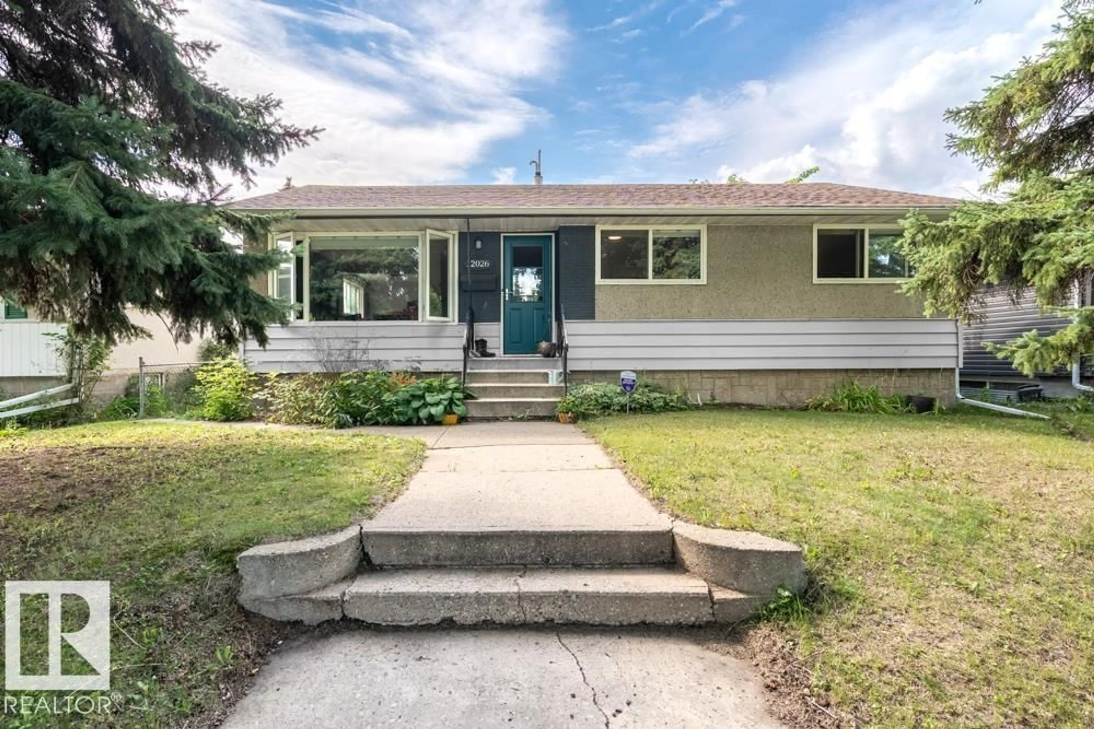Home with vinyl exterior material, street for 12026 38 ST NW, Edmonton Alberta T5W2H8