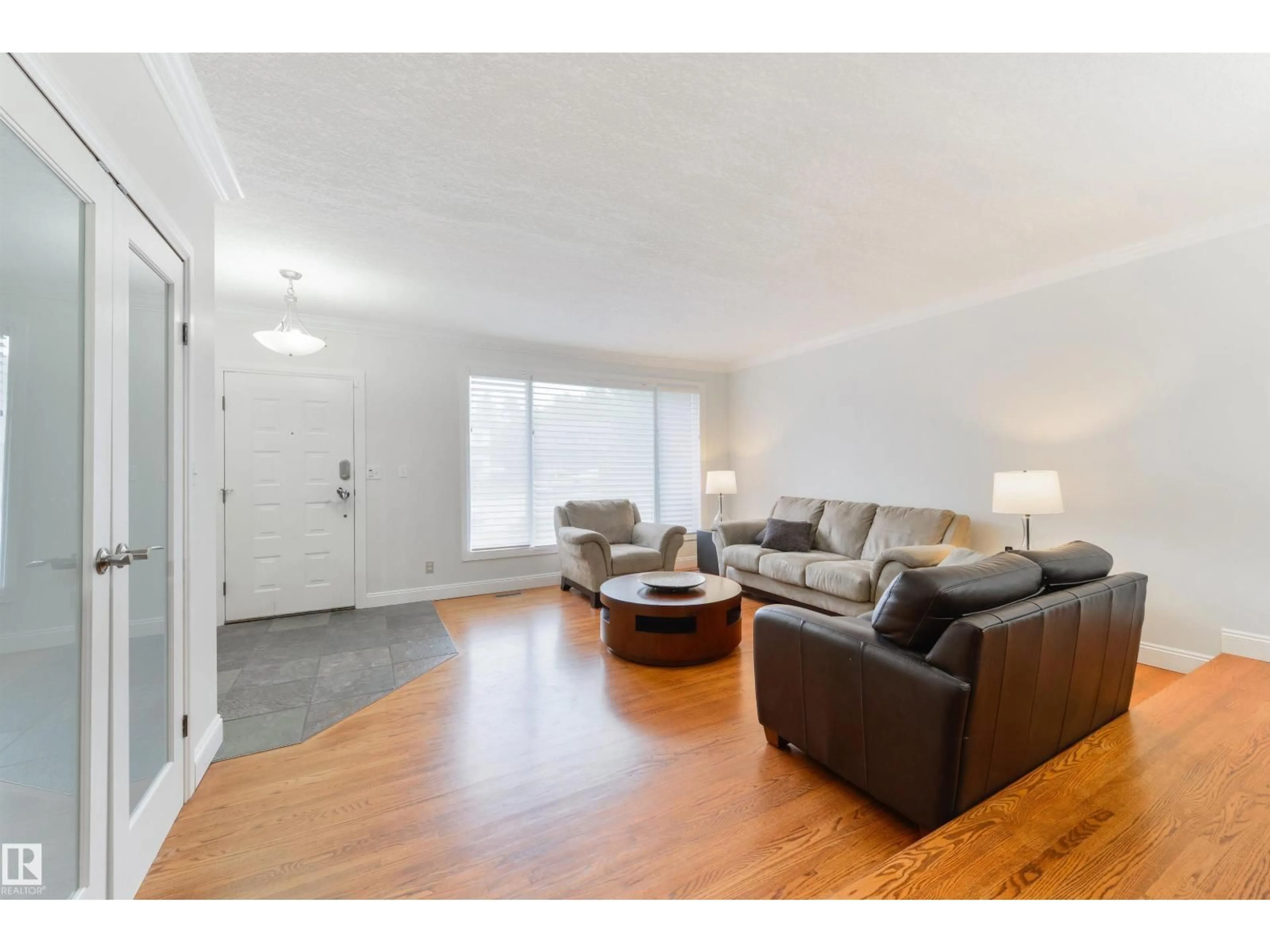 Living room with furniture, wood/laminate floor for 256 WESTRIDGE RD, Edmonton Alberta T5T1C3