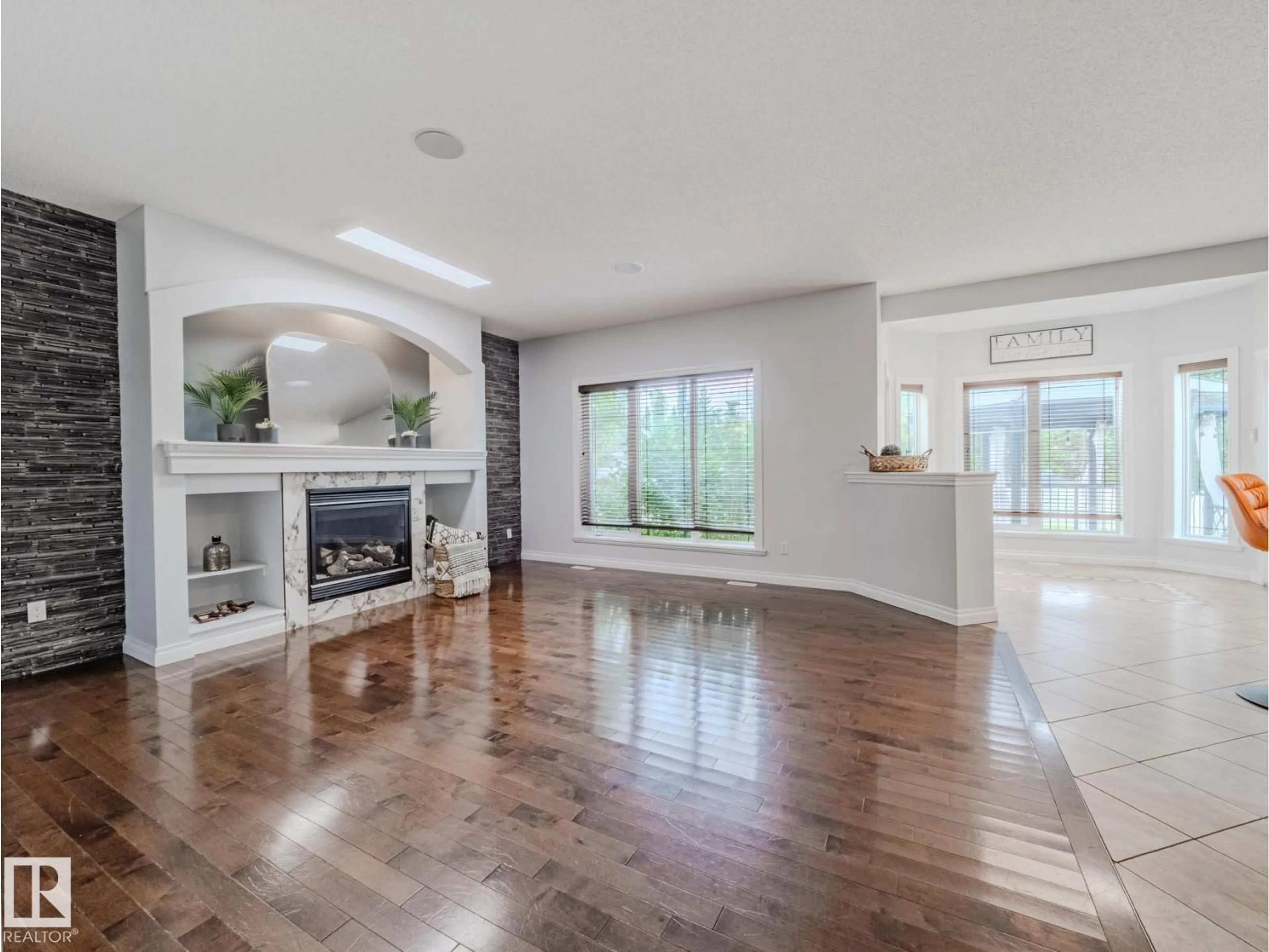 Living room with furniture, wood/laminate floor for 78 RUE MOREAU, Beaumont Alberta T4X1V7