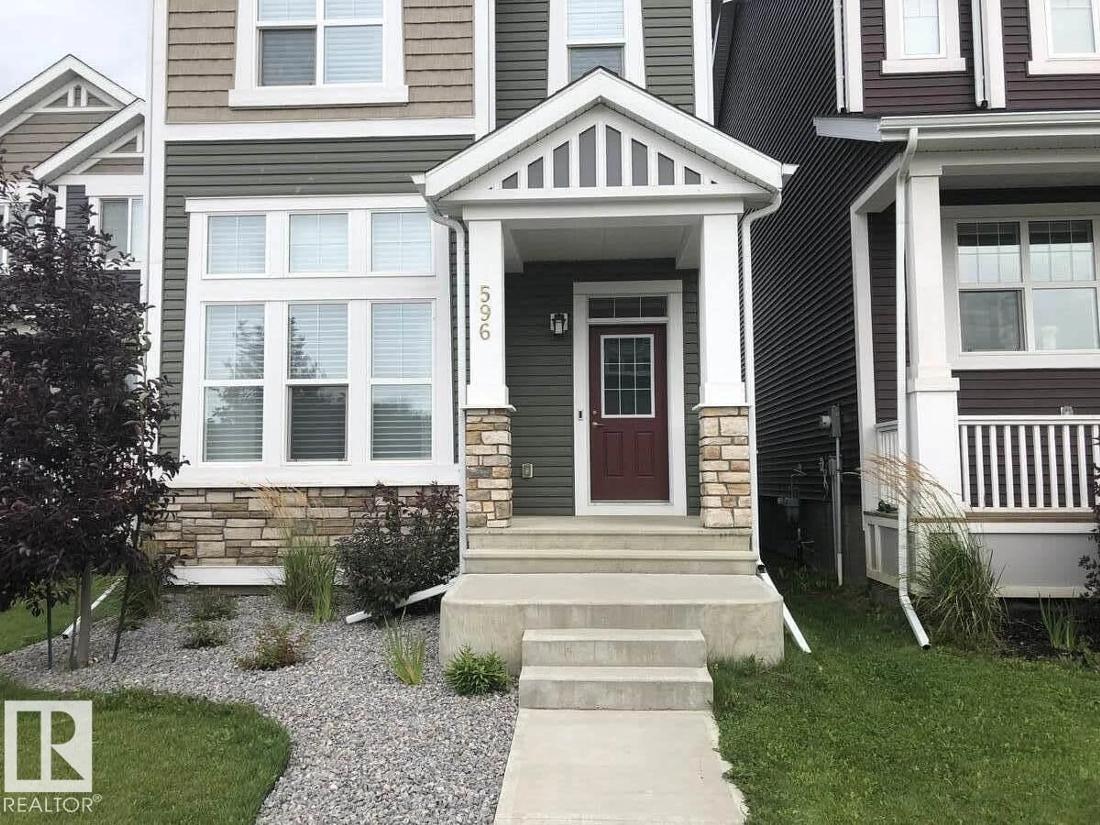 Home with vinyl exterior material, street for 596 STOUT BN, Leduc Alberta T9E1K3