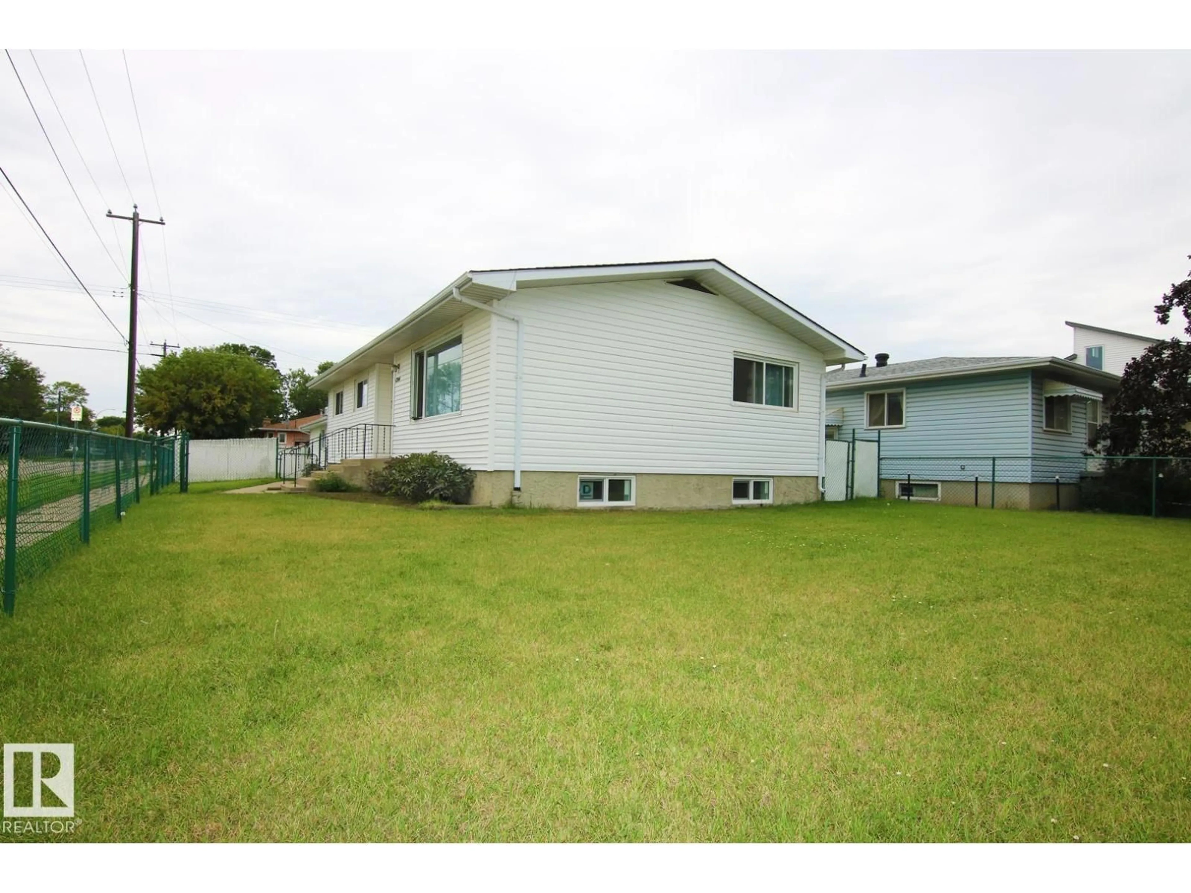 A pic from outside/outdoor area/front of a property/back of a property/a pic from drone, unknown for 4304 121 AV, Edmonton Alberta T5W1M7
